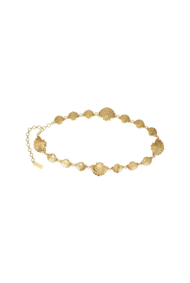 Gold bracelet with shell designs on a white background
