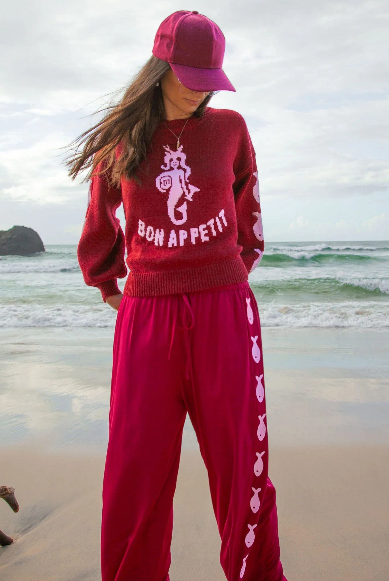 Deep red pants from Palm Collective with embroidered fish down the sides.