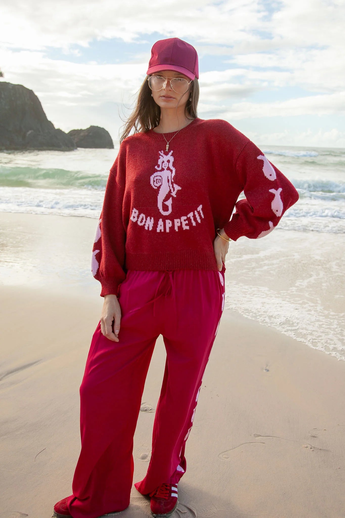 Deep red pants from Palm Collective with embroidered fish down the sides.