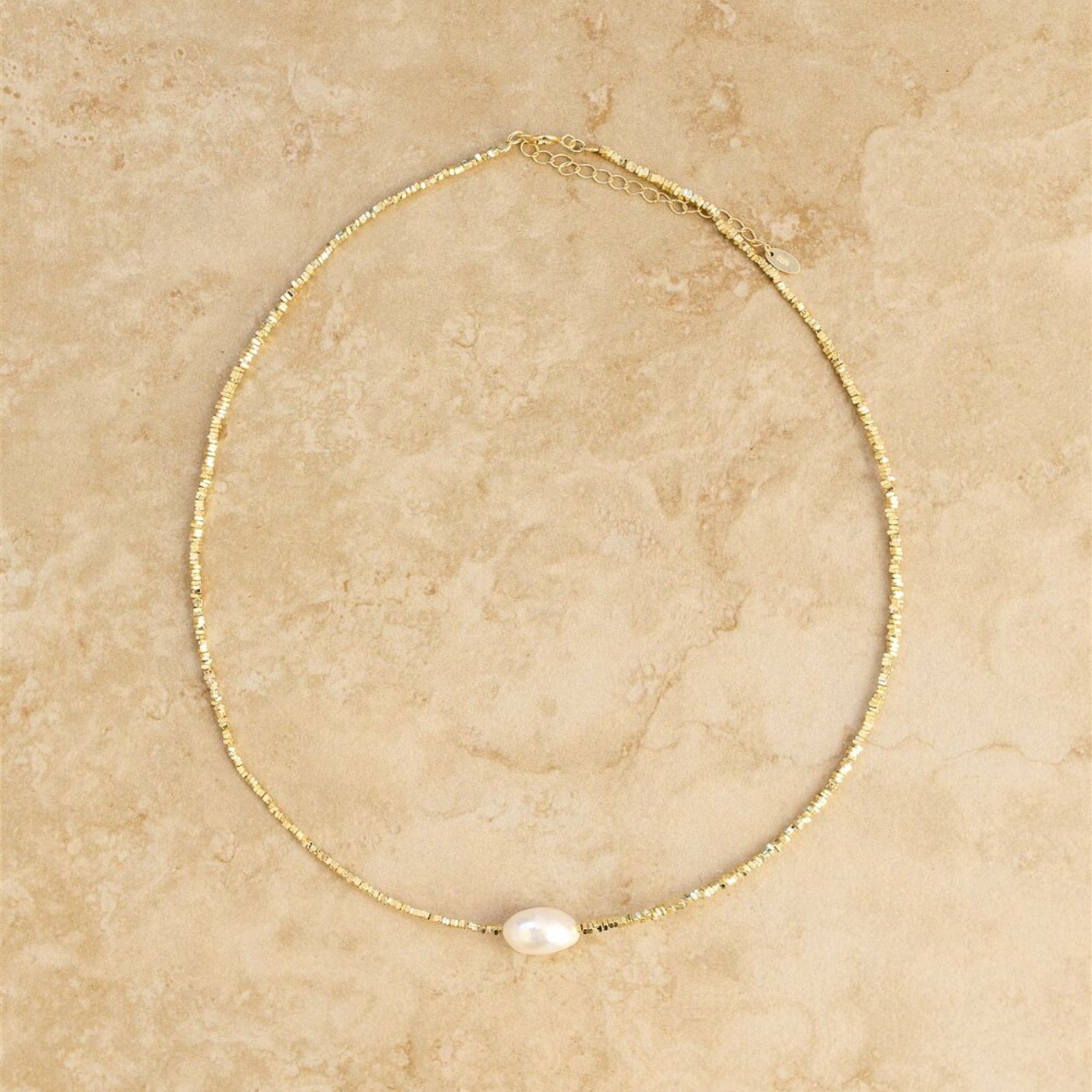 The gold and pearl tahiti necklace from indigo and wolfe - choker length