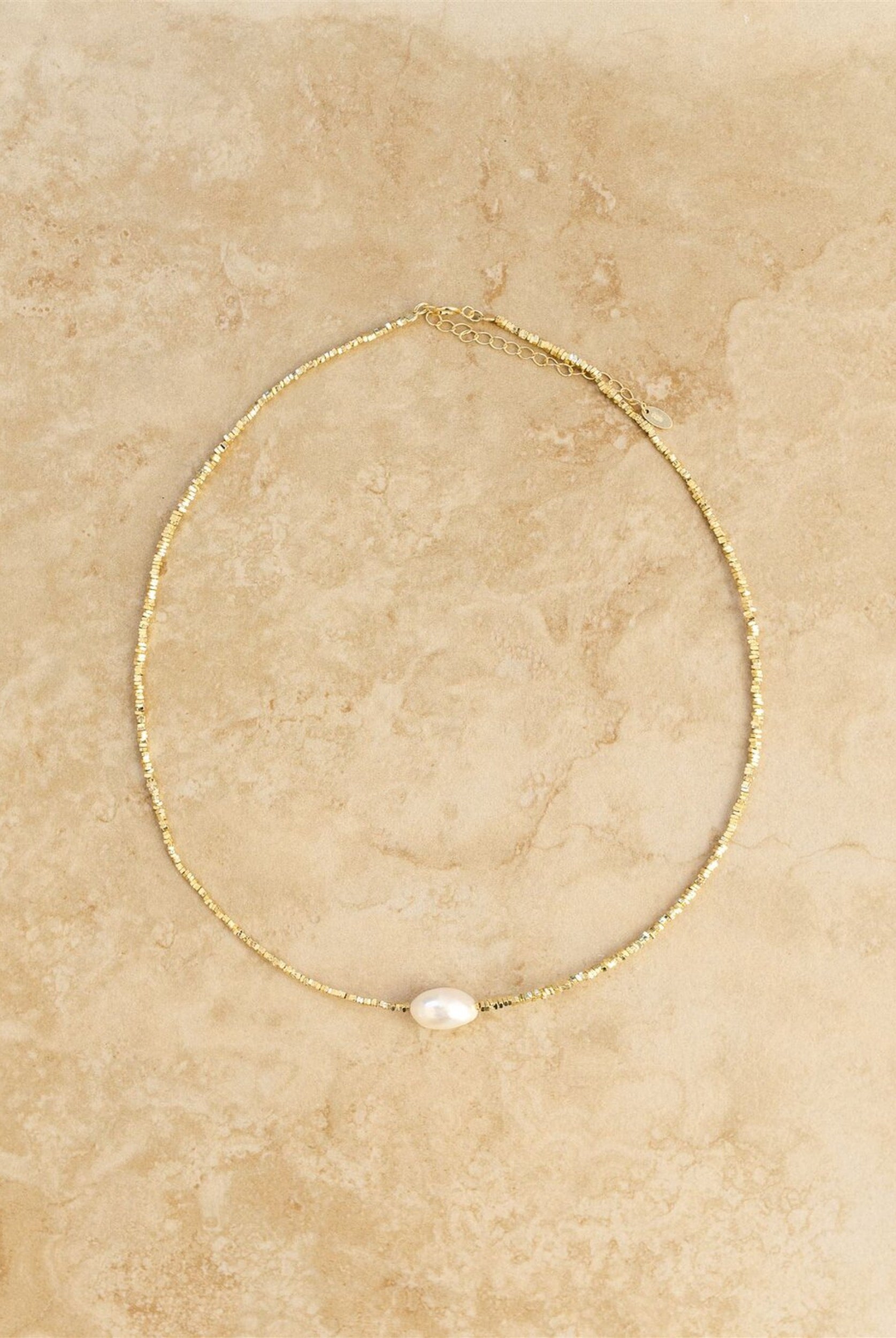 The gold and pearl tahiti necklace from indigo and wolfe - choker length