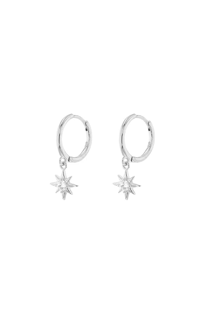 Pair of silver hoop earrings with star-shaped drops on a white background