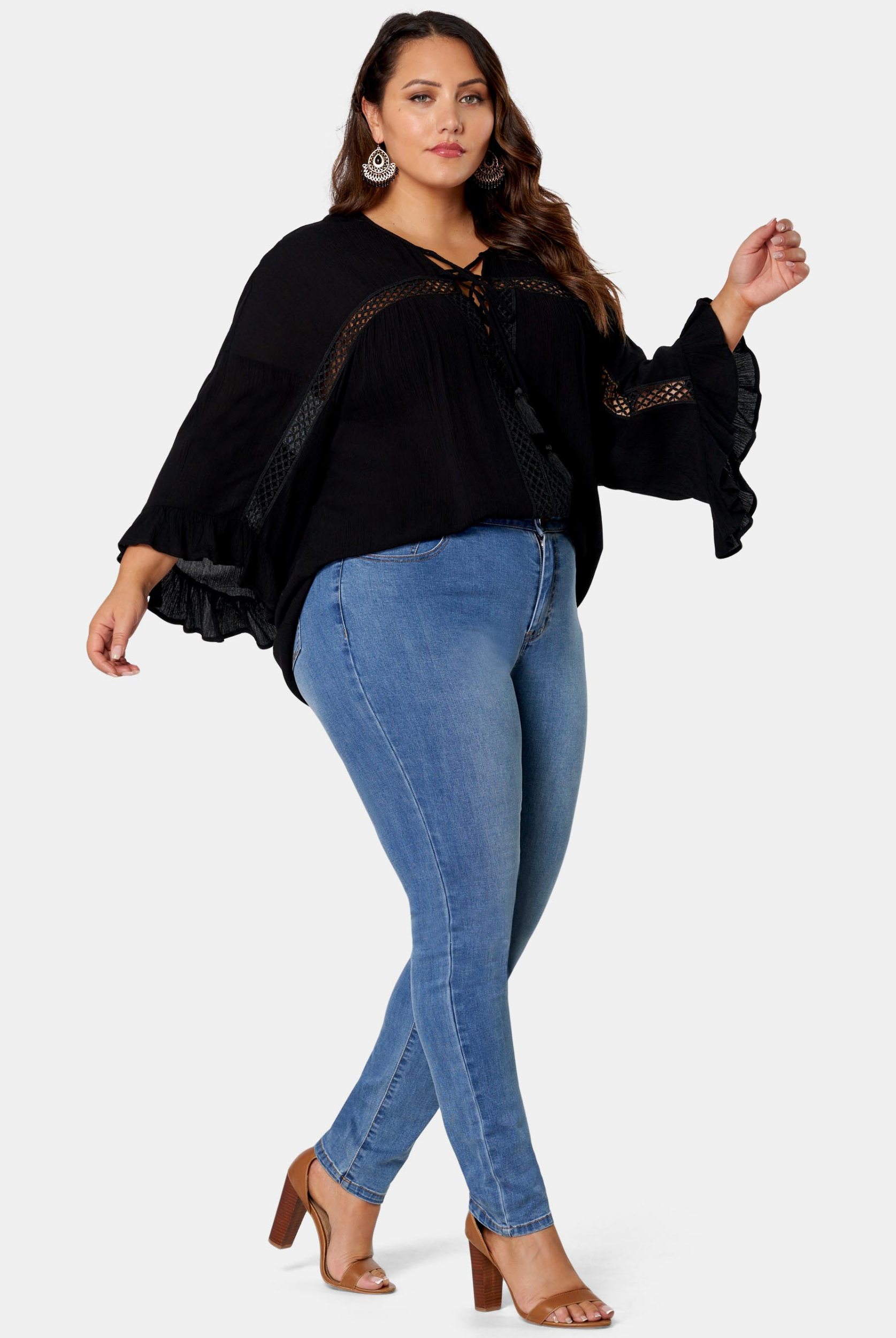 Woman wearing black boho blouse