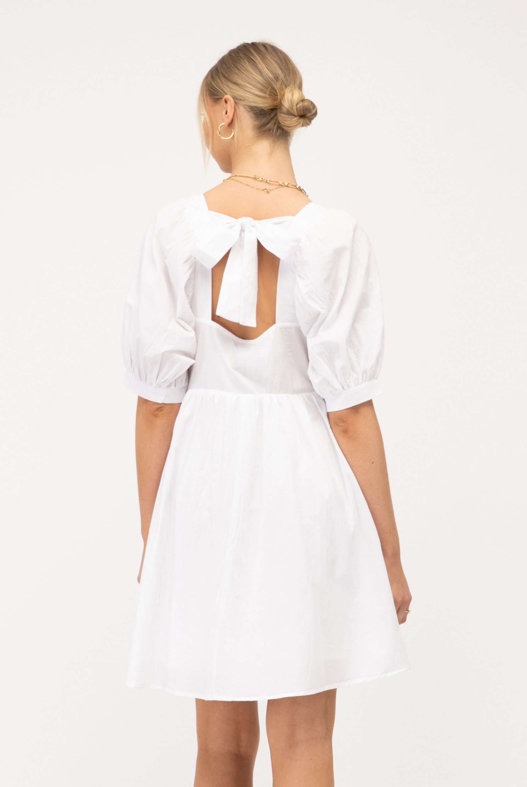 Model wearing Paper Heart white Sonia dress with pockets