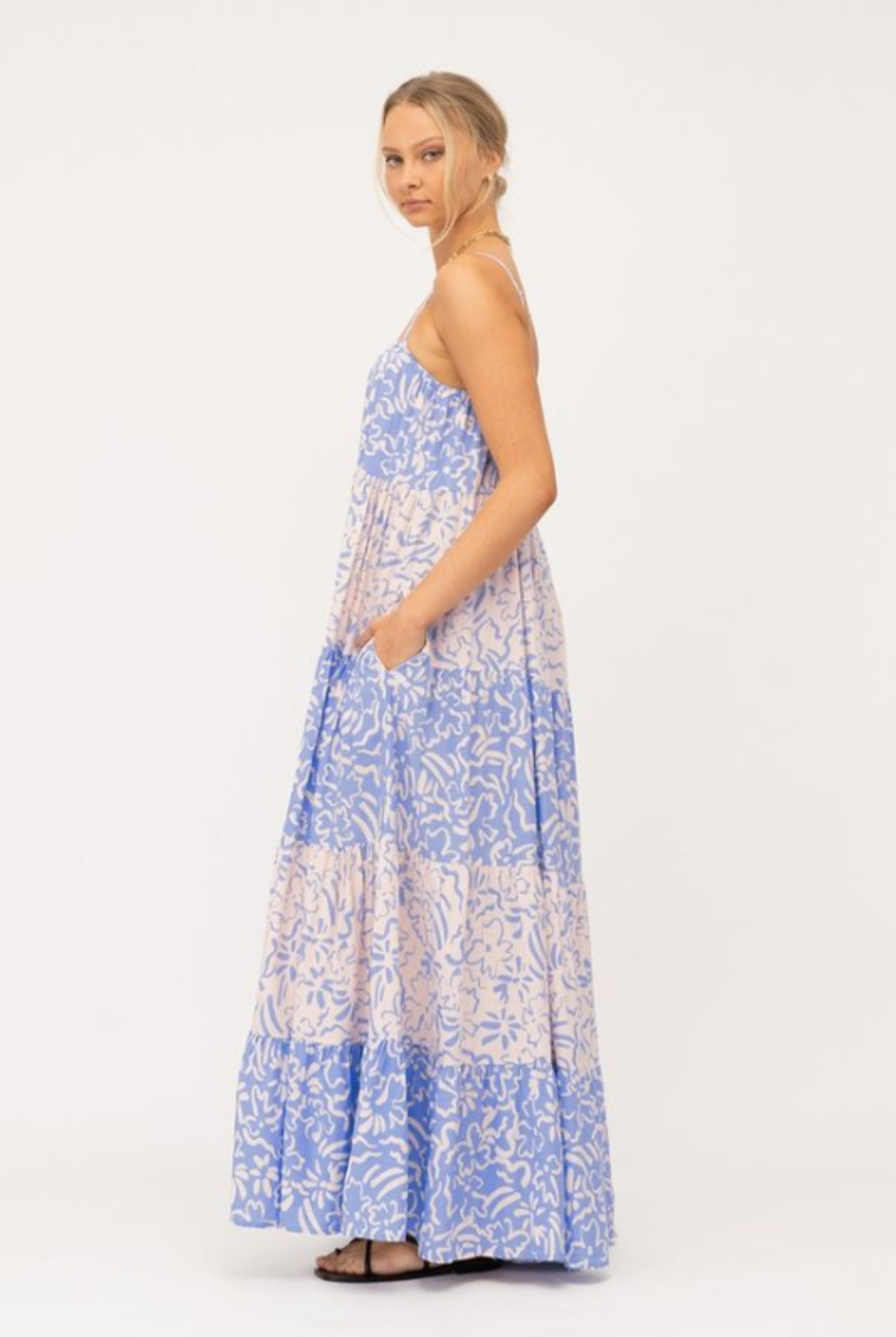 Model wearing tiered Livia Maxi Dress in blue and white mixed media print