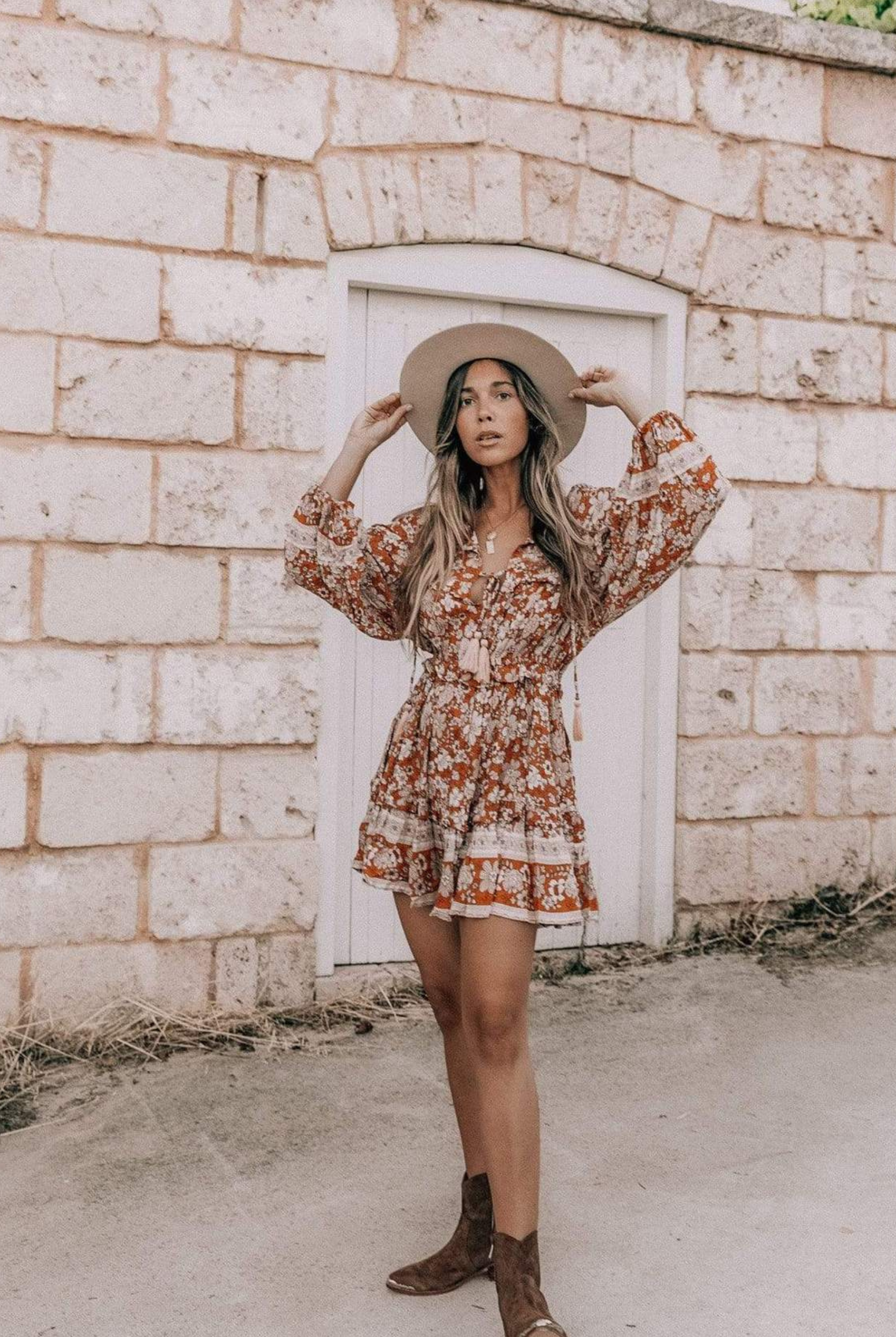 Model wearing floral print boho mini dress