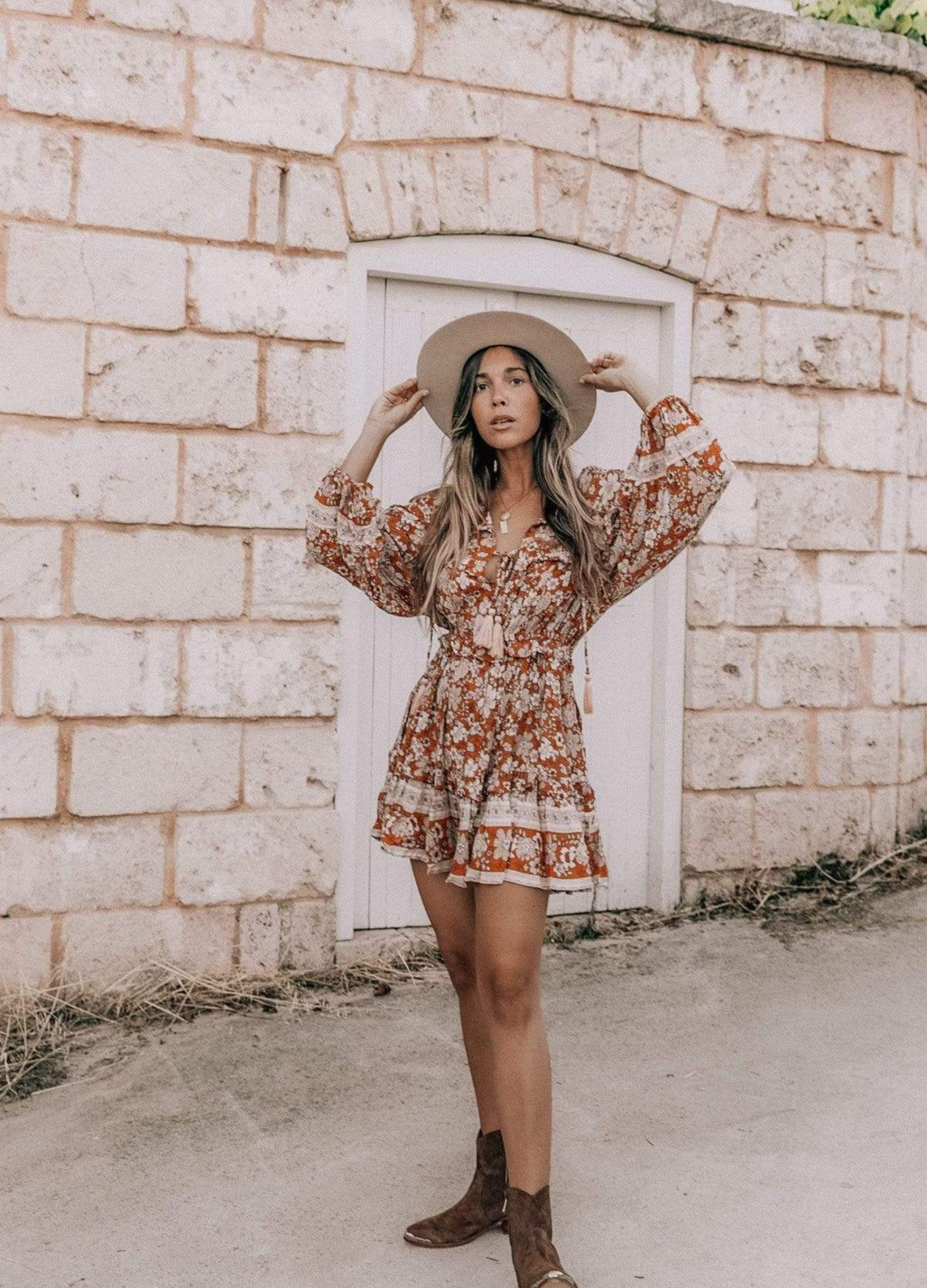 Model wearing floral print boho mini dress