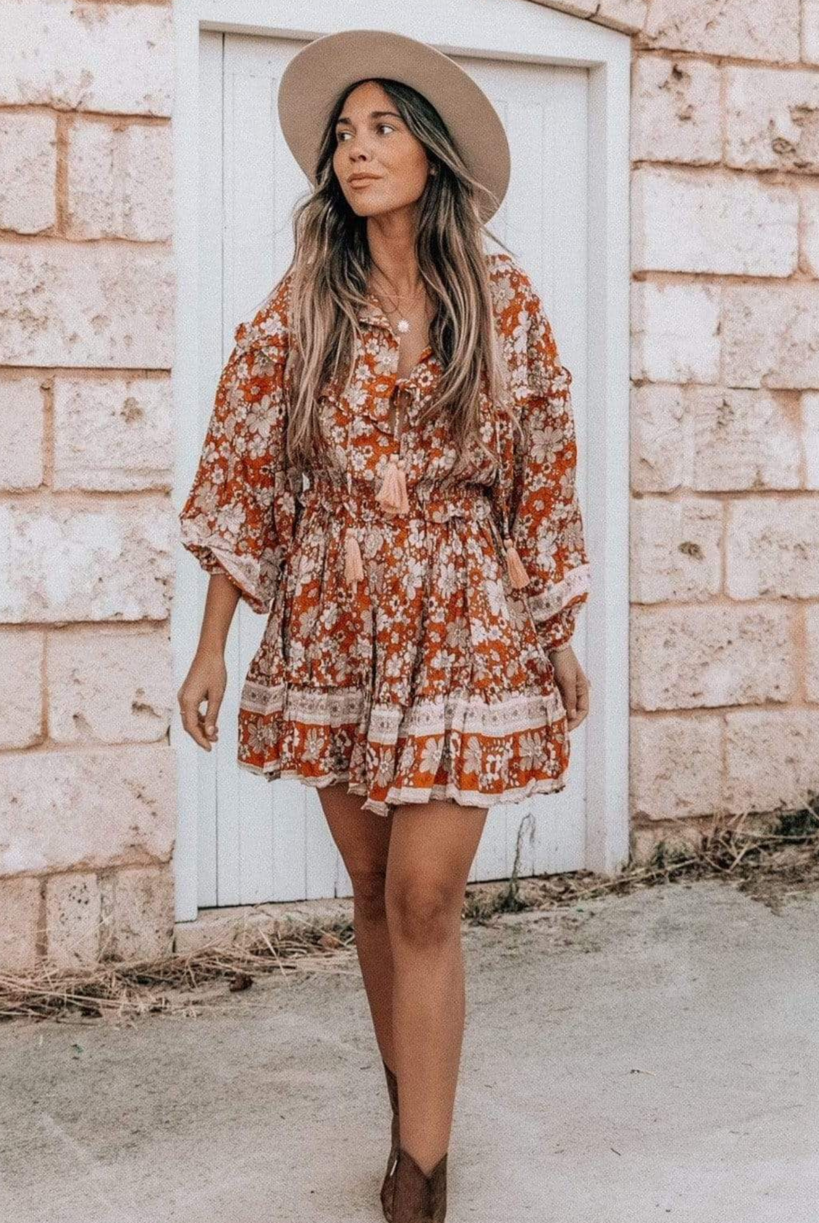 Model wearing floral print boho mini dress