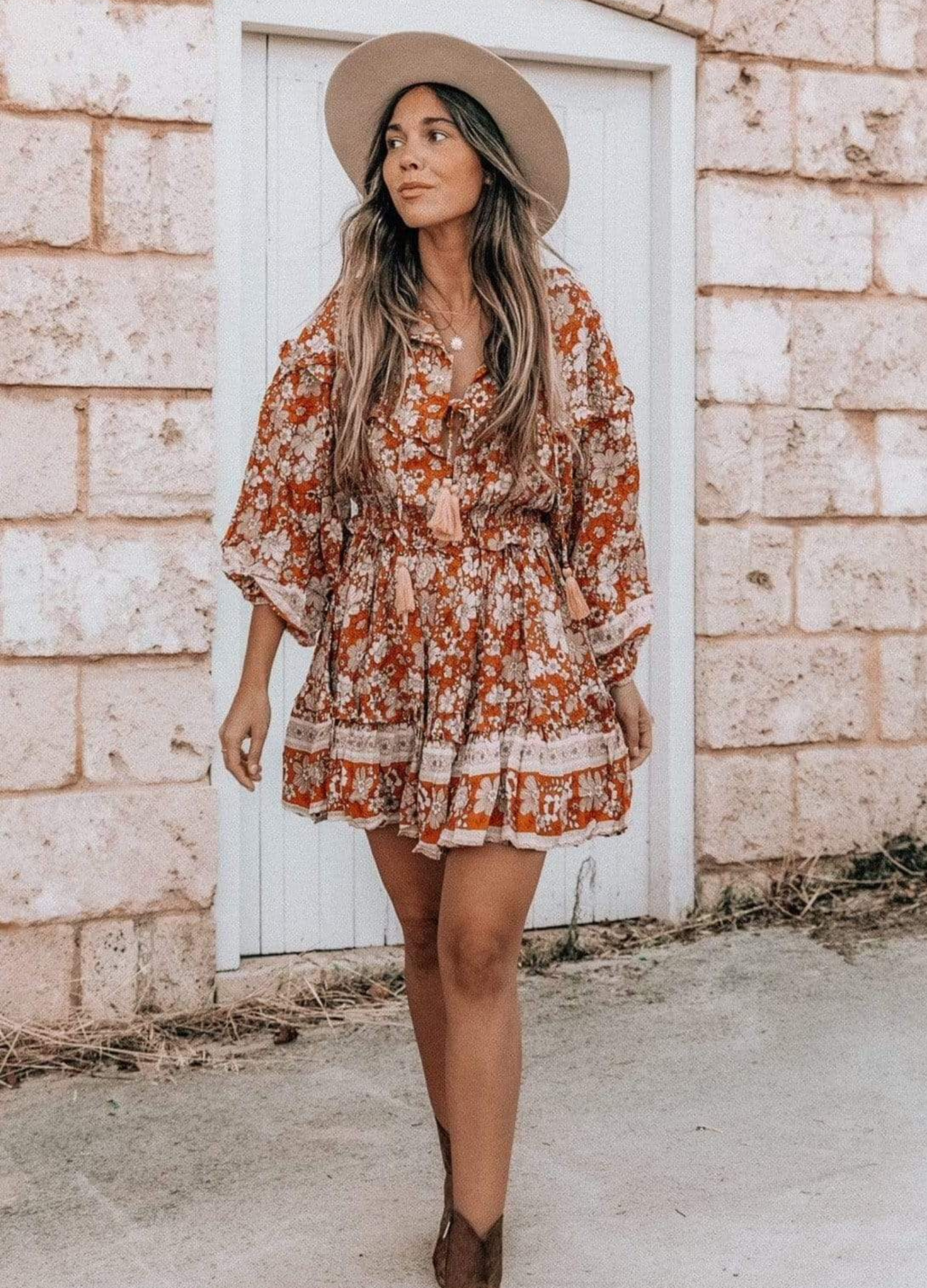 Model wearing floral print boho mini dress