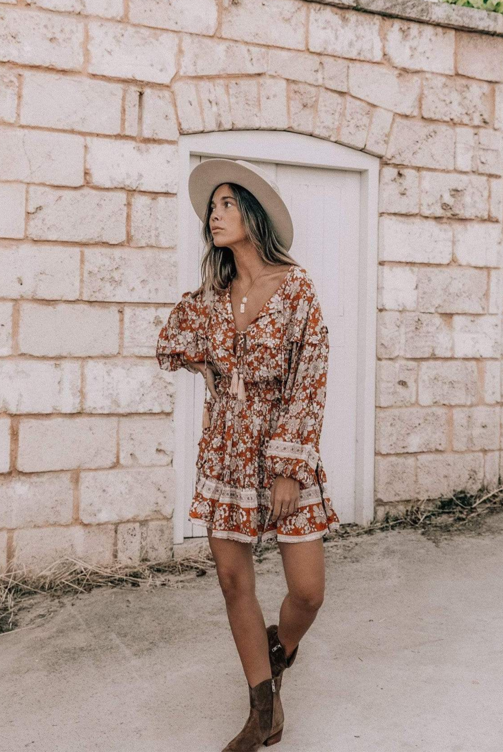 Model wearing floral print boho mini dress