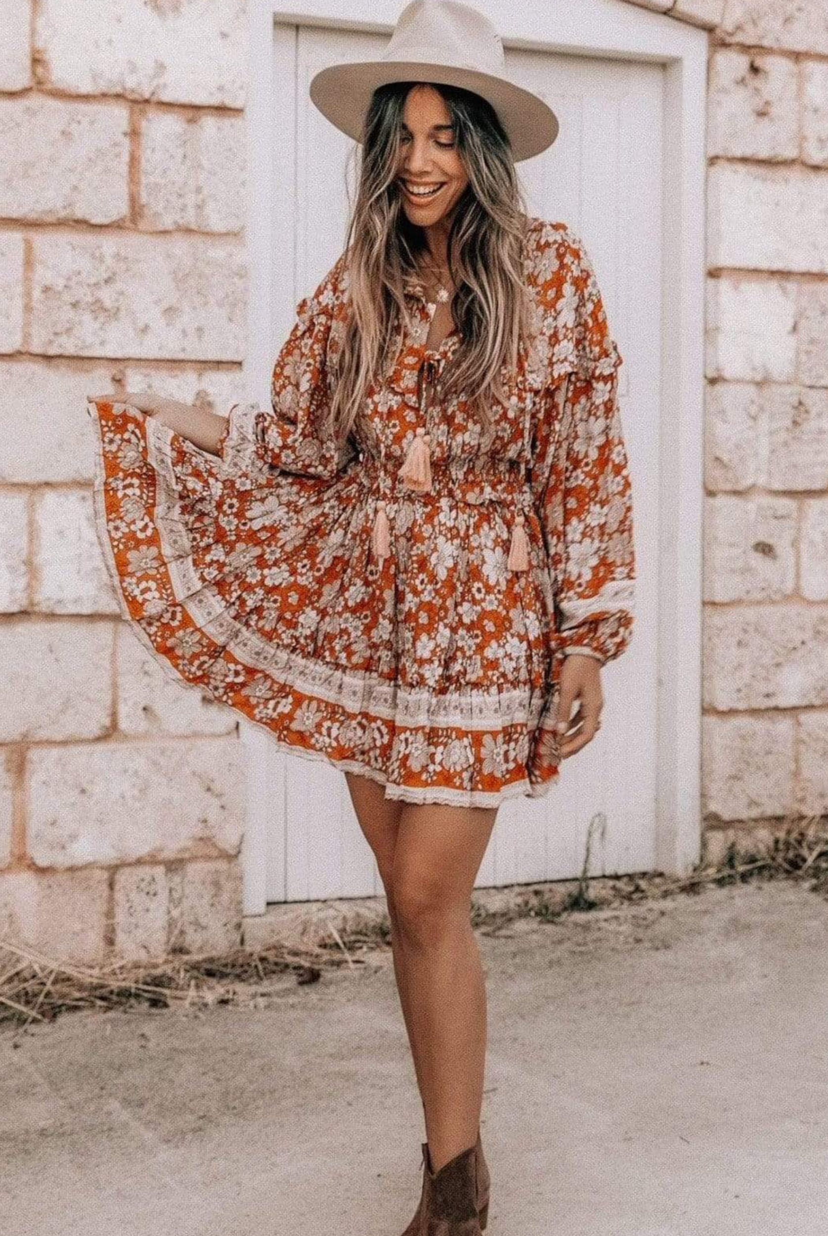 Model wearing floral print boho mini dress