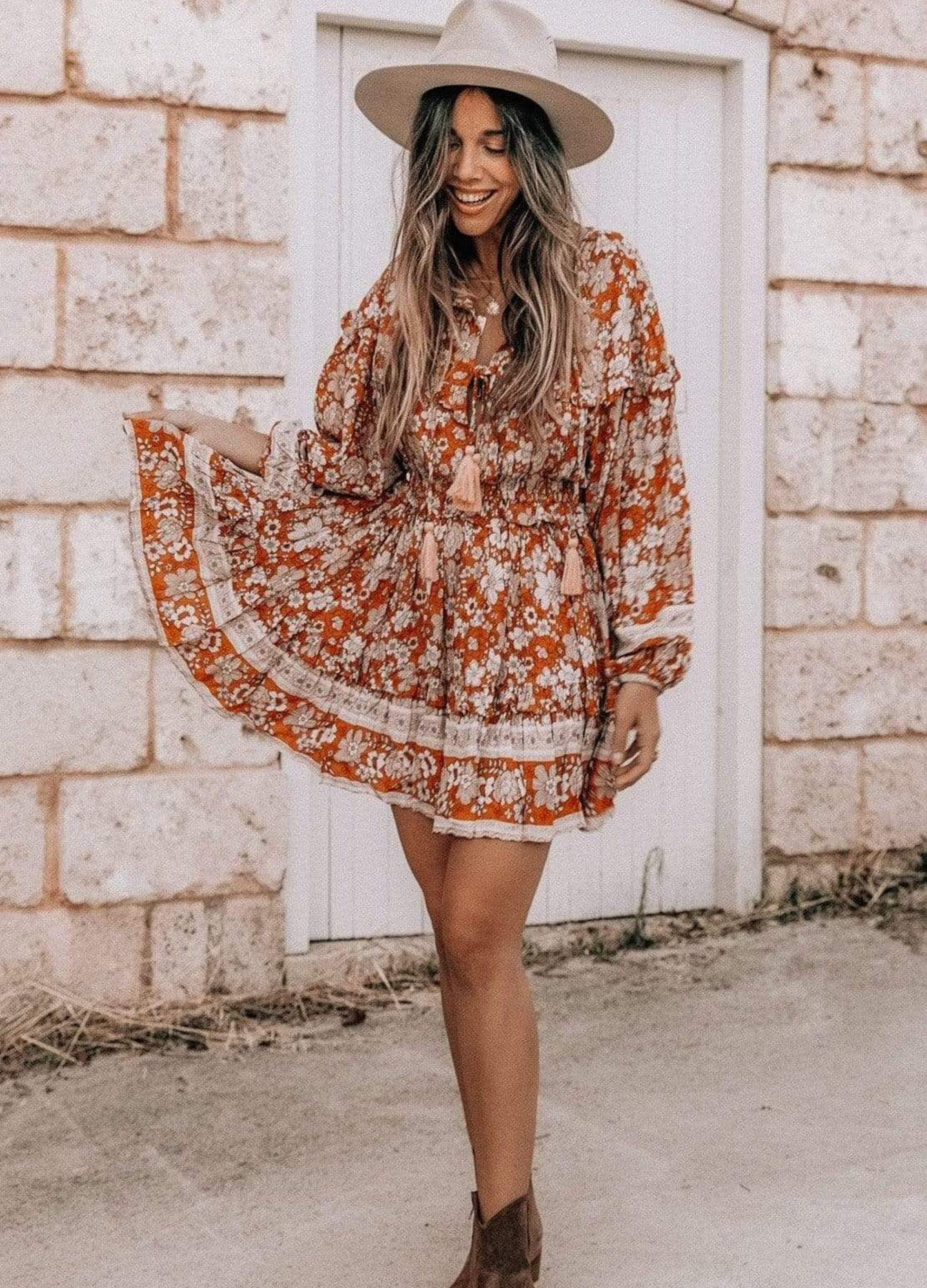 Model wearing floral print boho mini dress