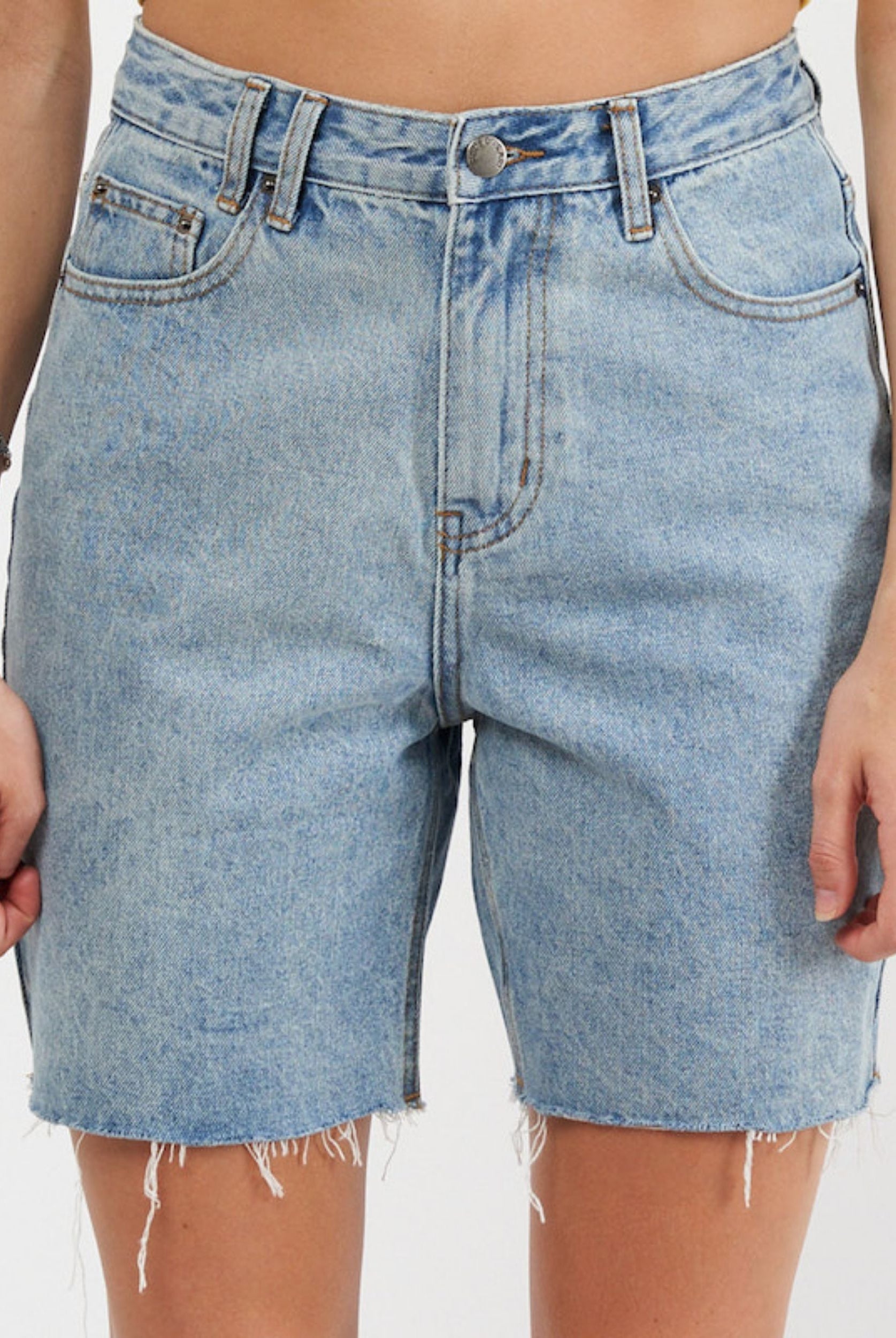 Model wearing lightwash denim short