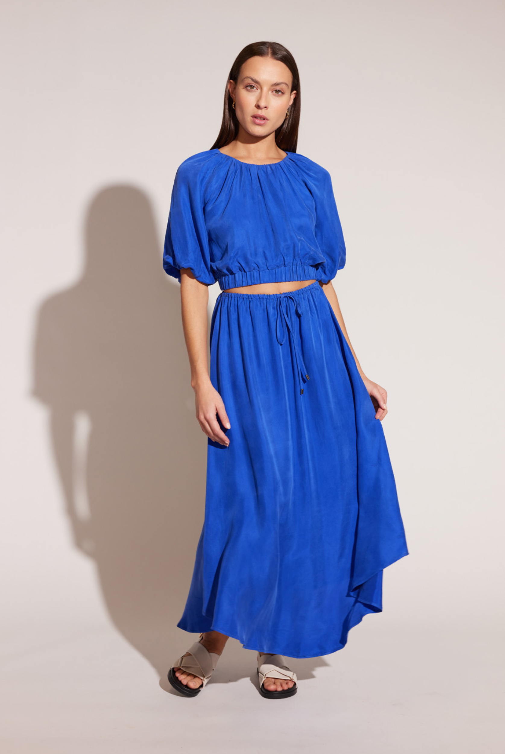 Model wearing the Azur Blue Cupro top with matching skirt