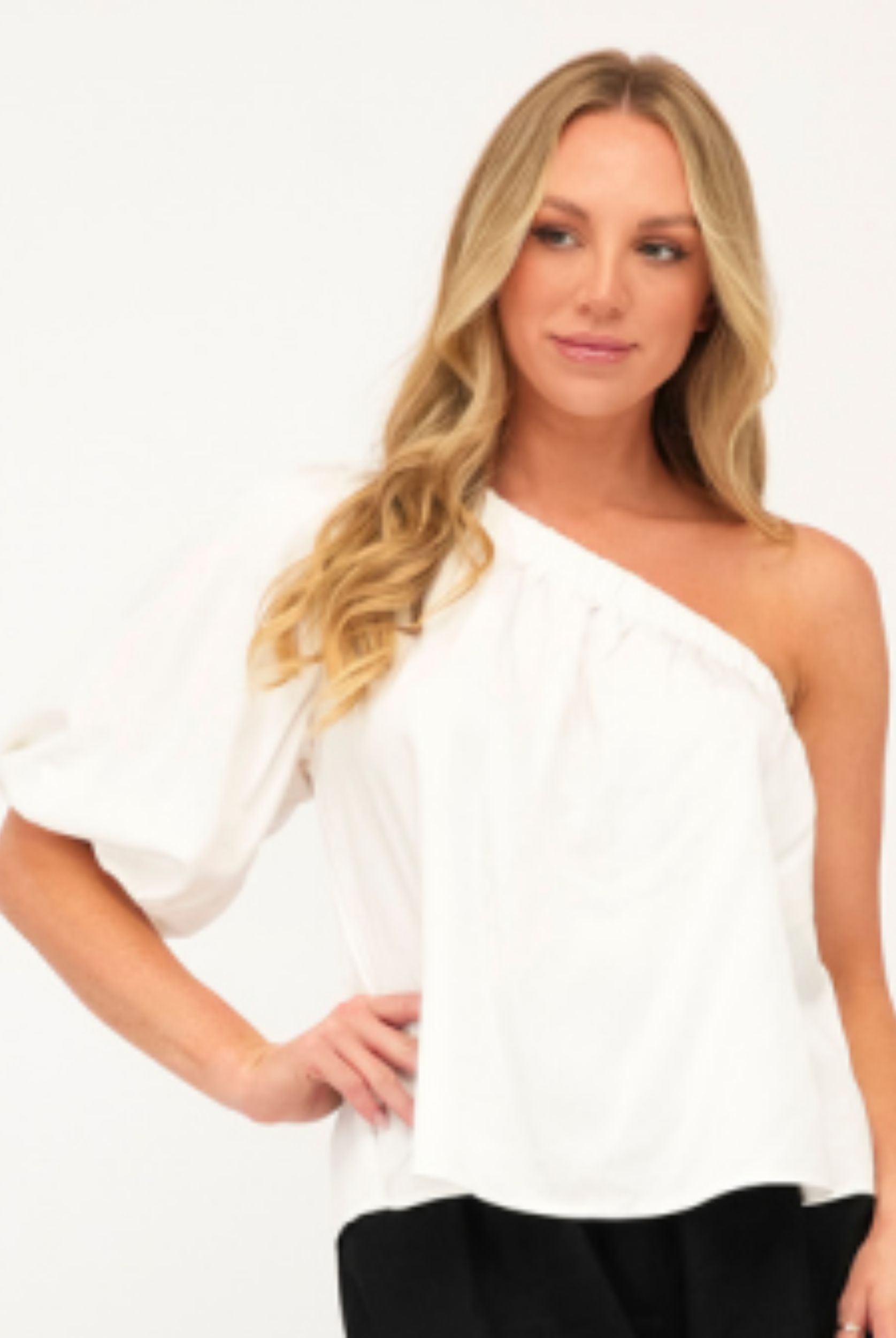 Model wearing white one shoulder top