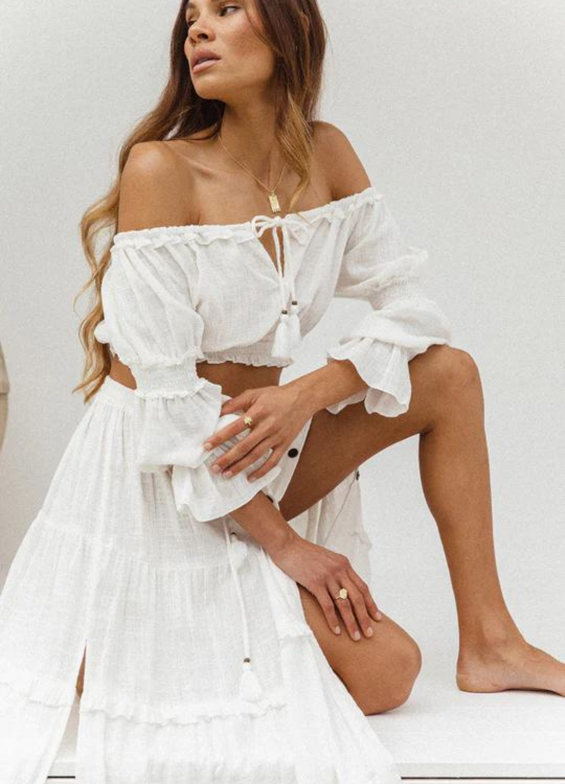 Model wearing the white esmeralda gypsy top with tie at centre front and mid sleeve