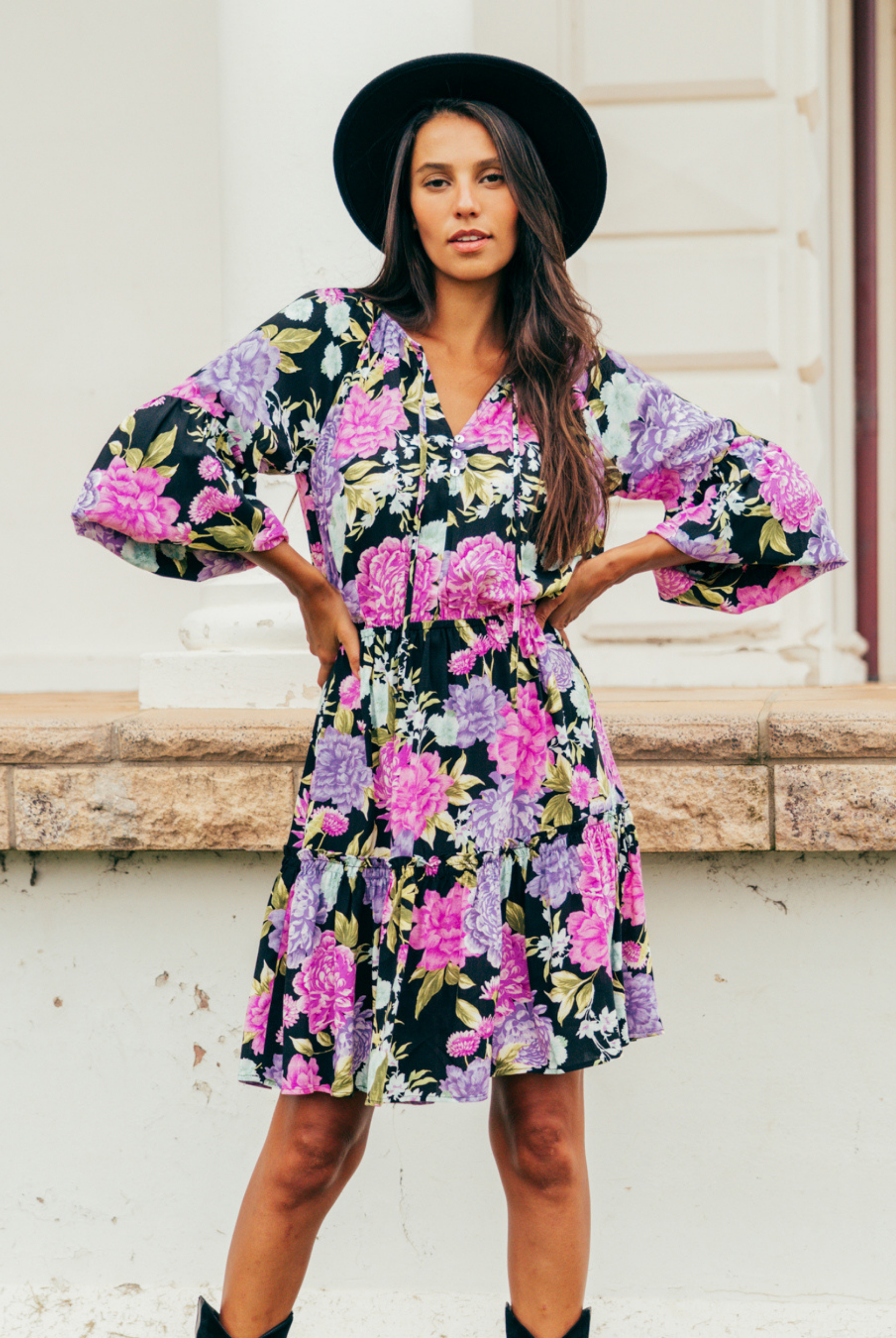 Model wearing the tarni mini dress in floral print
