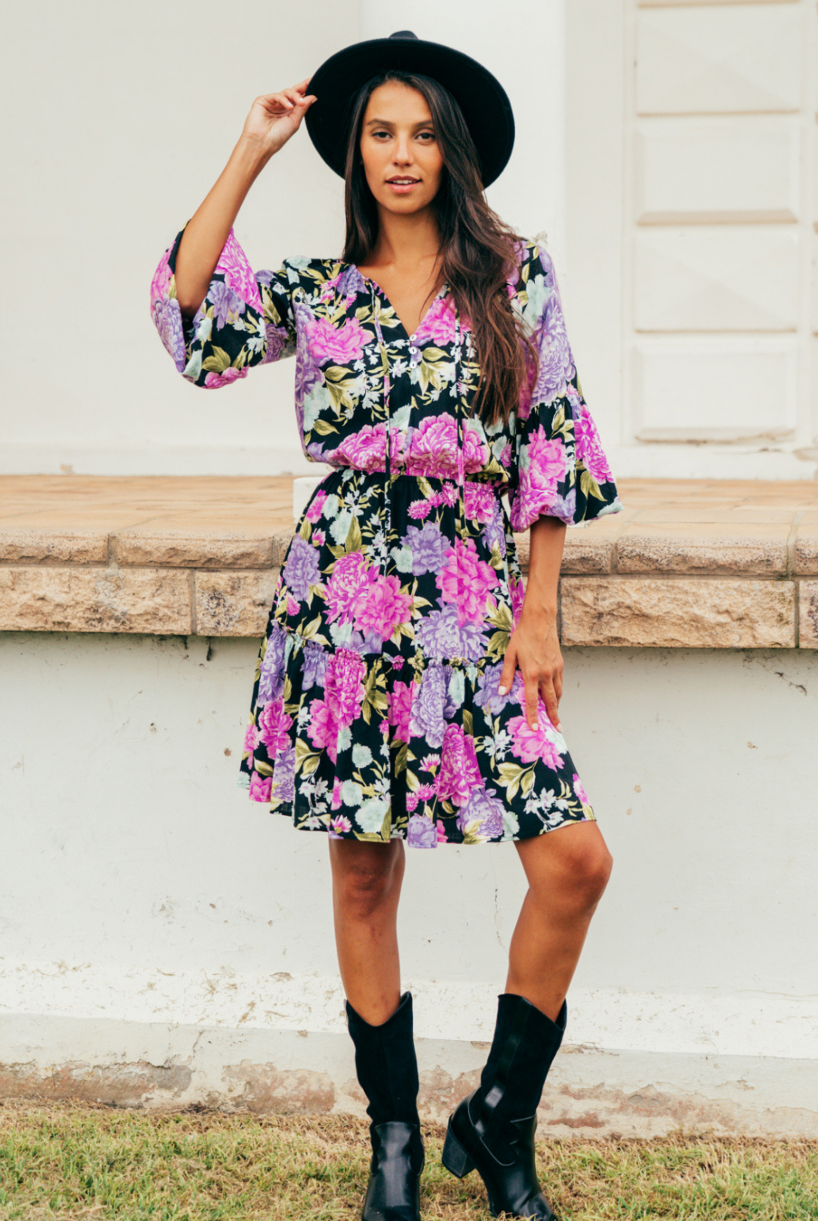 Model wearing the tarni mini dress in floral print