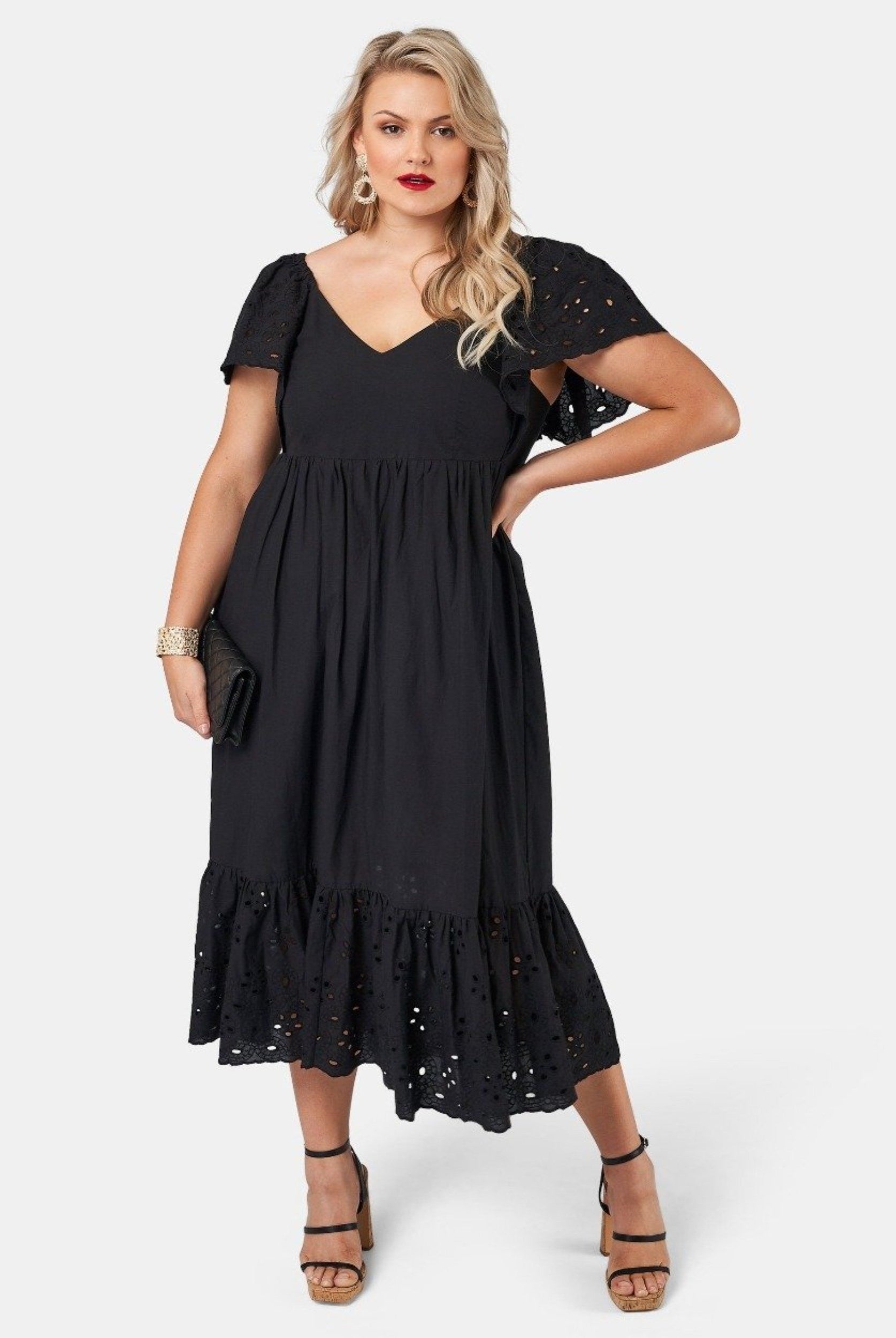 Blonde model wearing black cotton midi dress