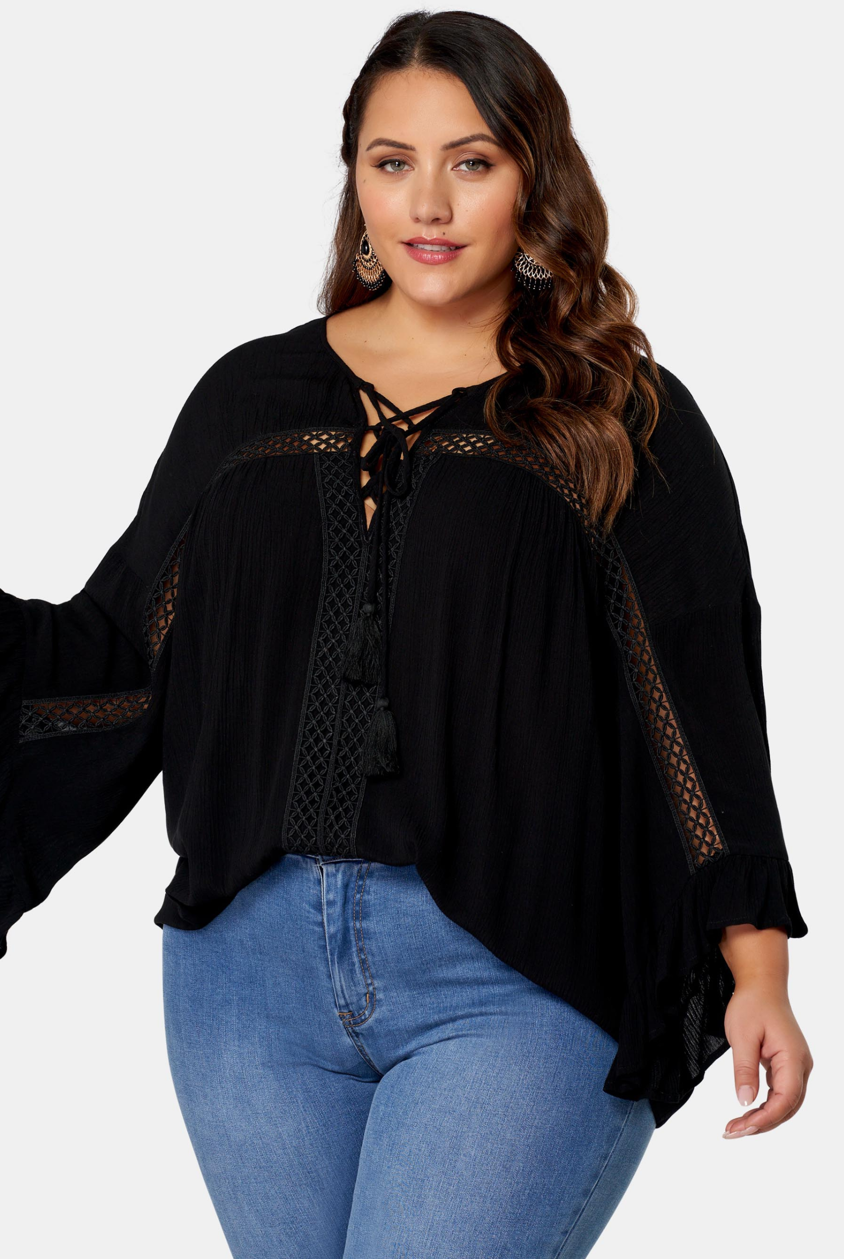 Woman wearing black boho blouse