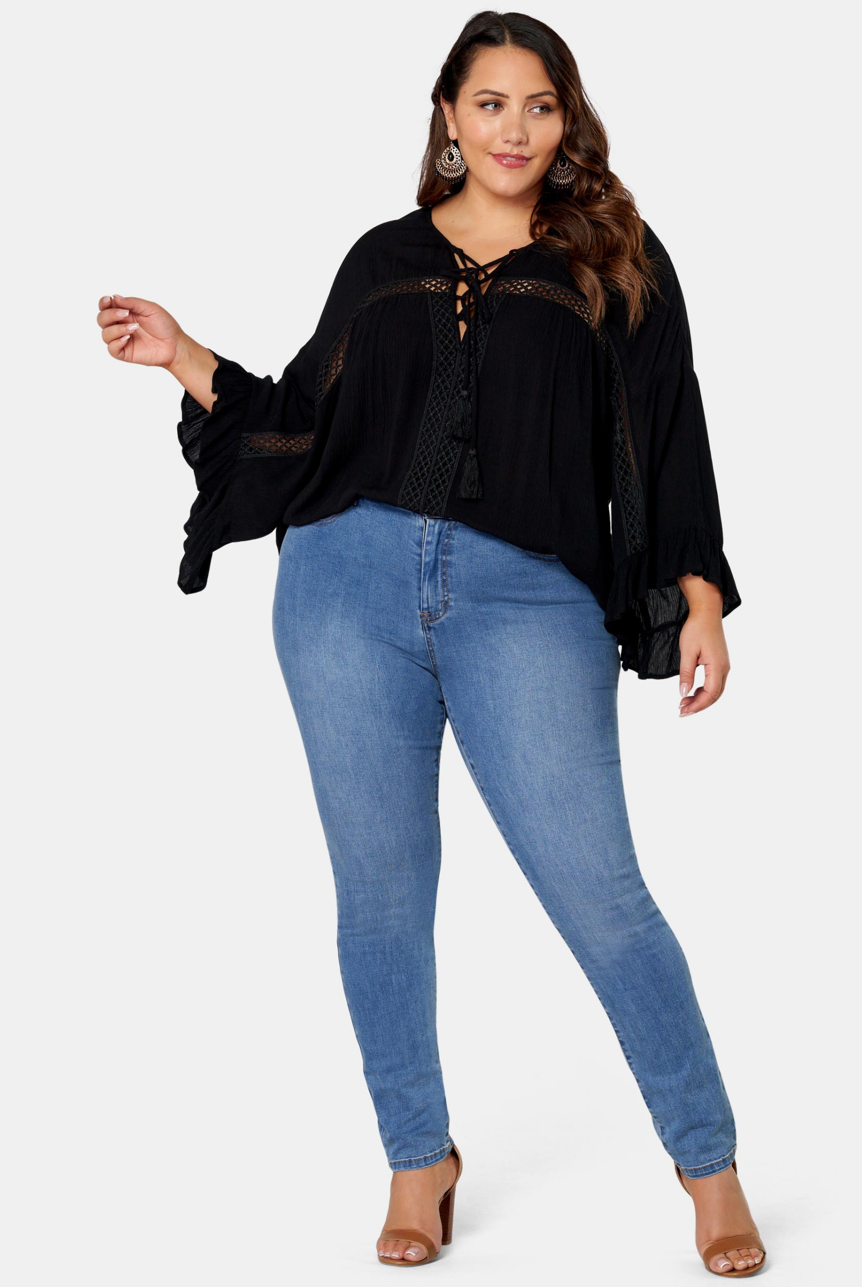 Woman wearing black boho blouse