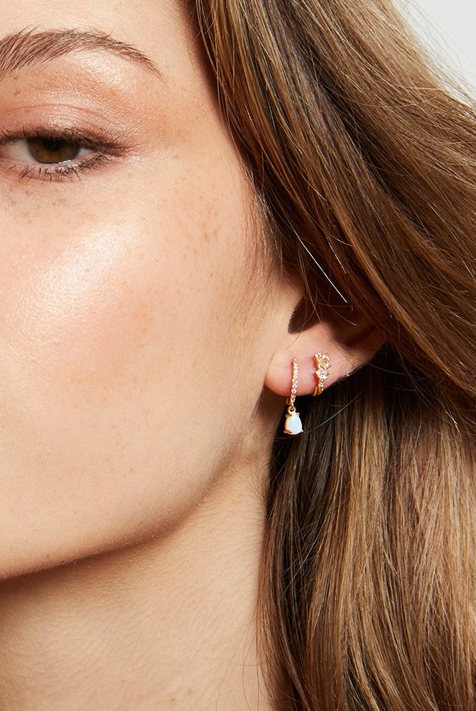 Aaliya earring in the ear of model with another sleeper to show how to wear