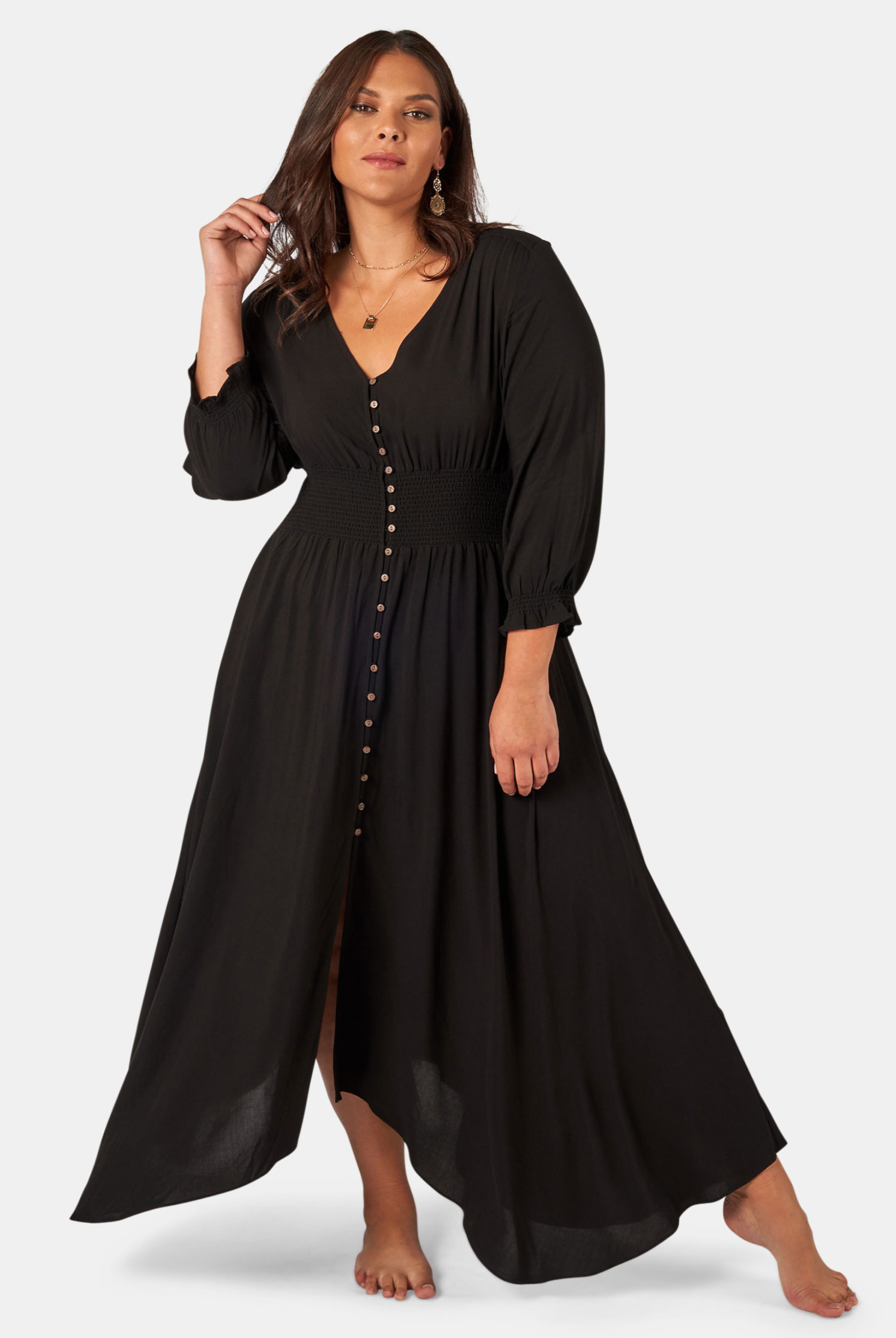 Model wearing the button through brown sugar dress in black