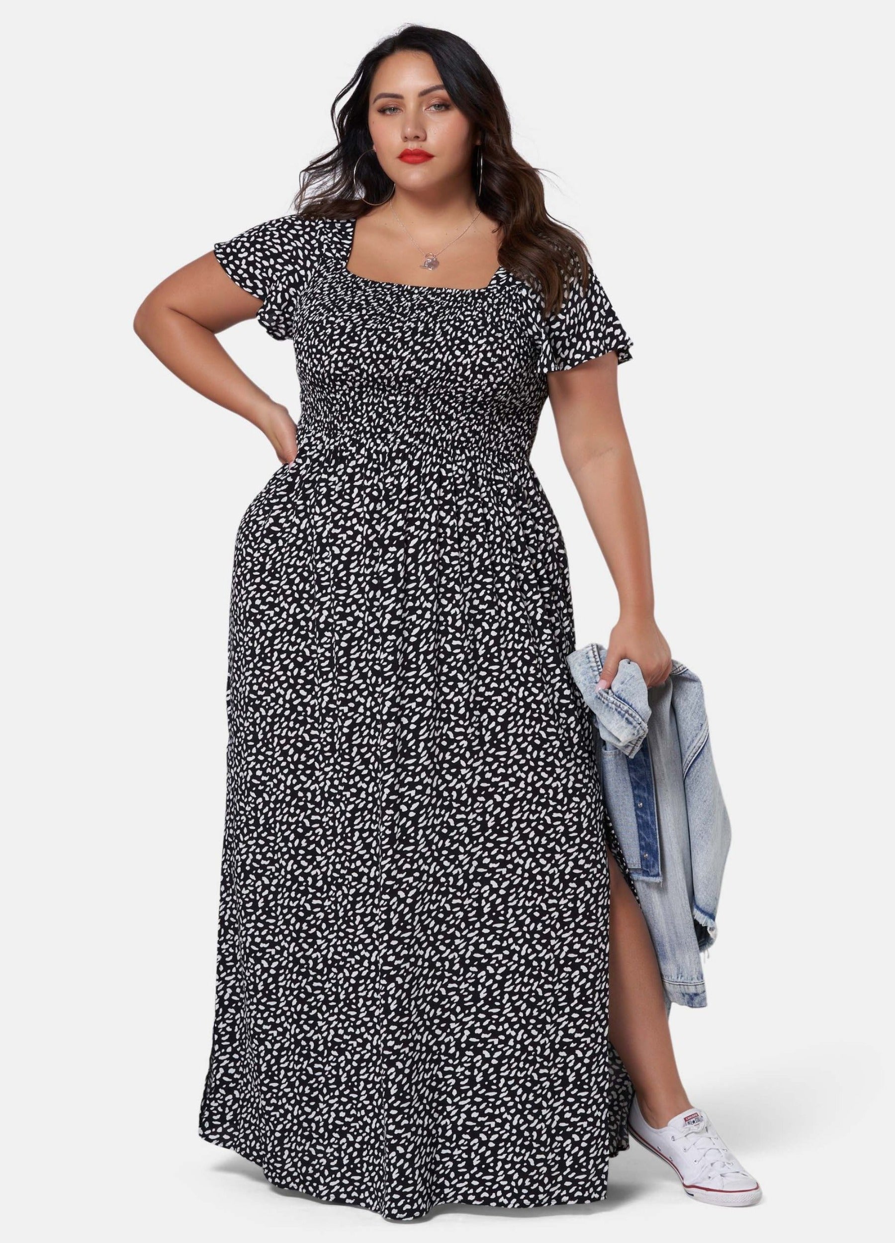 Woman wearing black and white print maxi dress