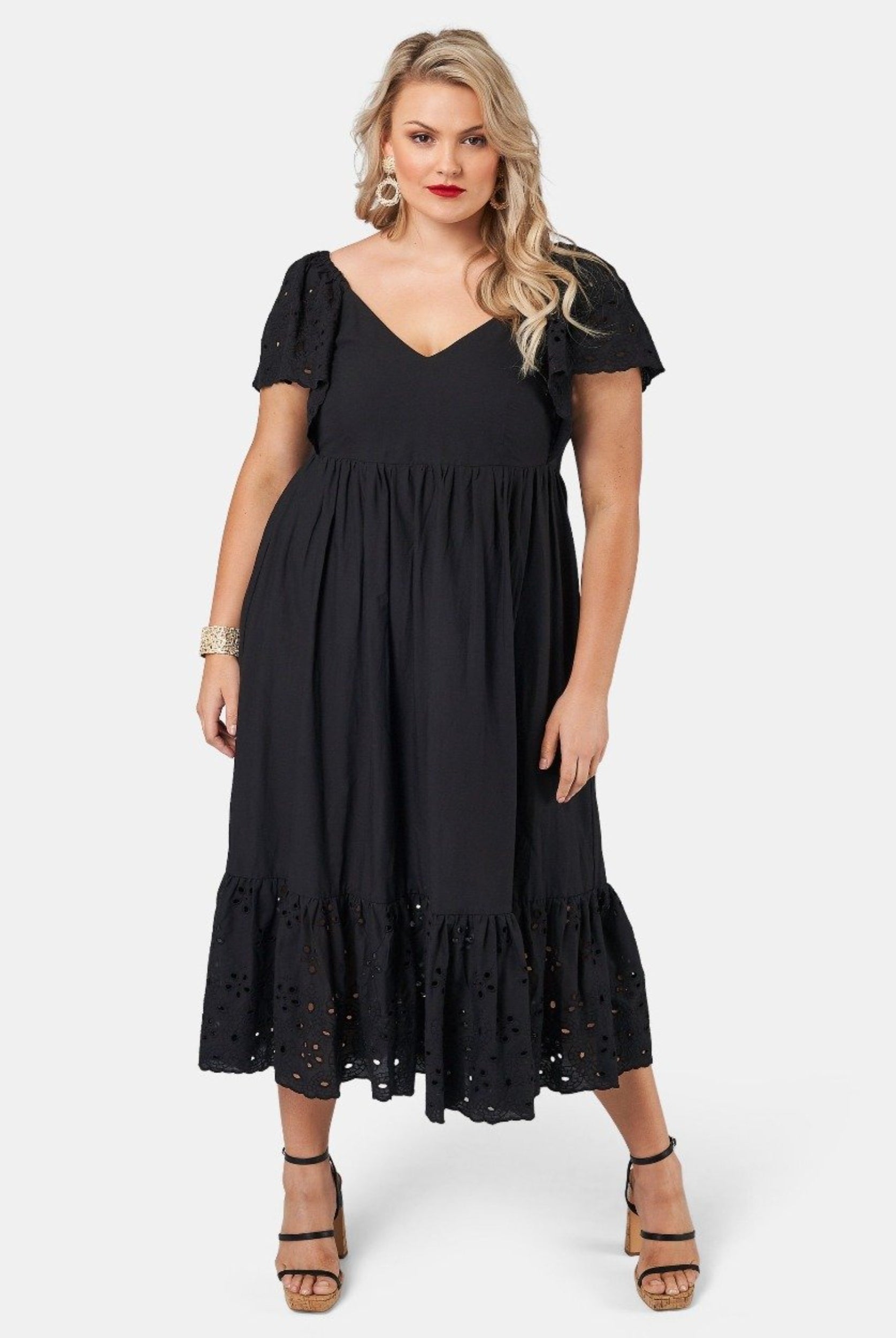 Blonde model wearing black cotton midi dress