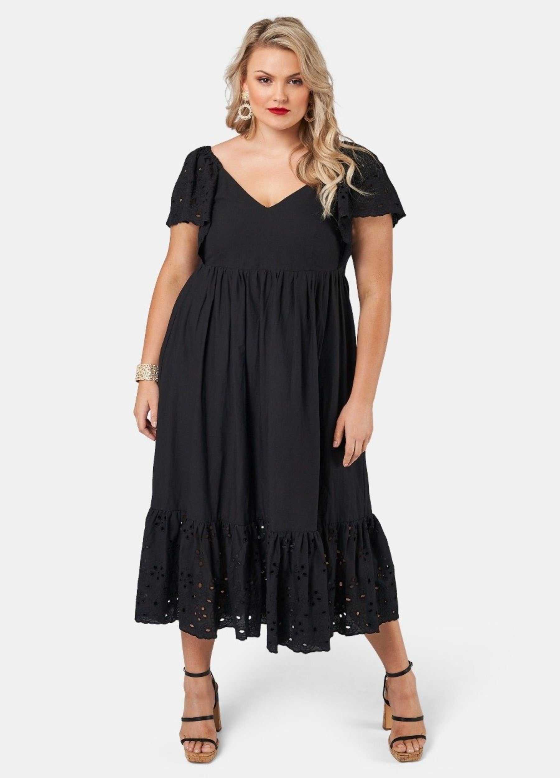 Blonde model wearing black cotton midi dress