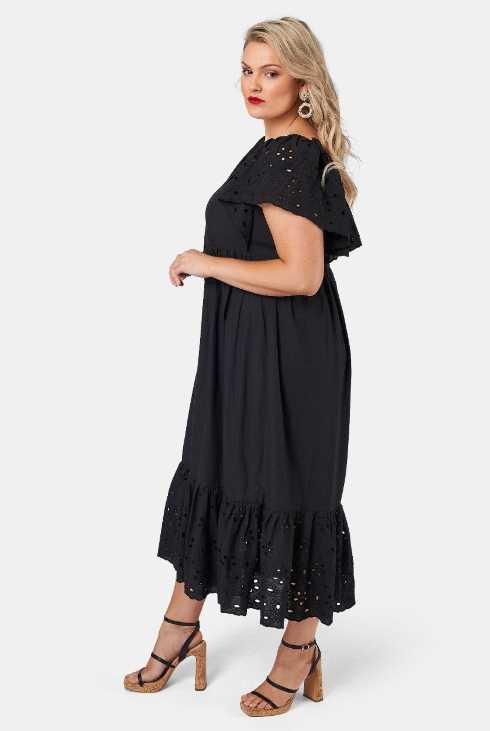 Blonde model wearing black cotton midi dress