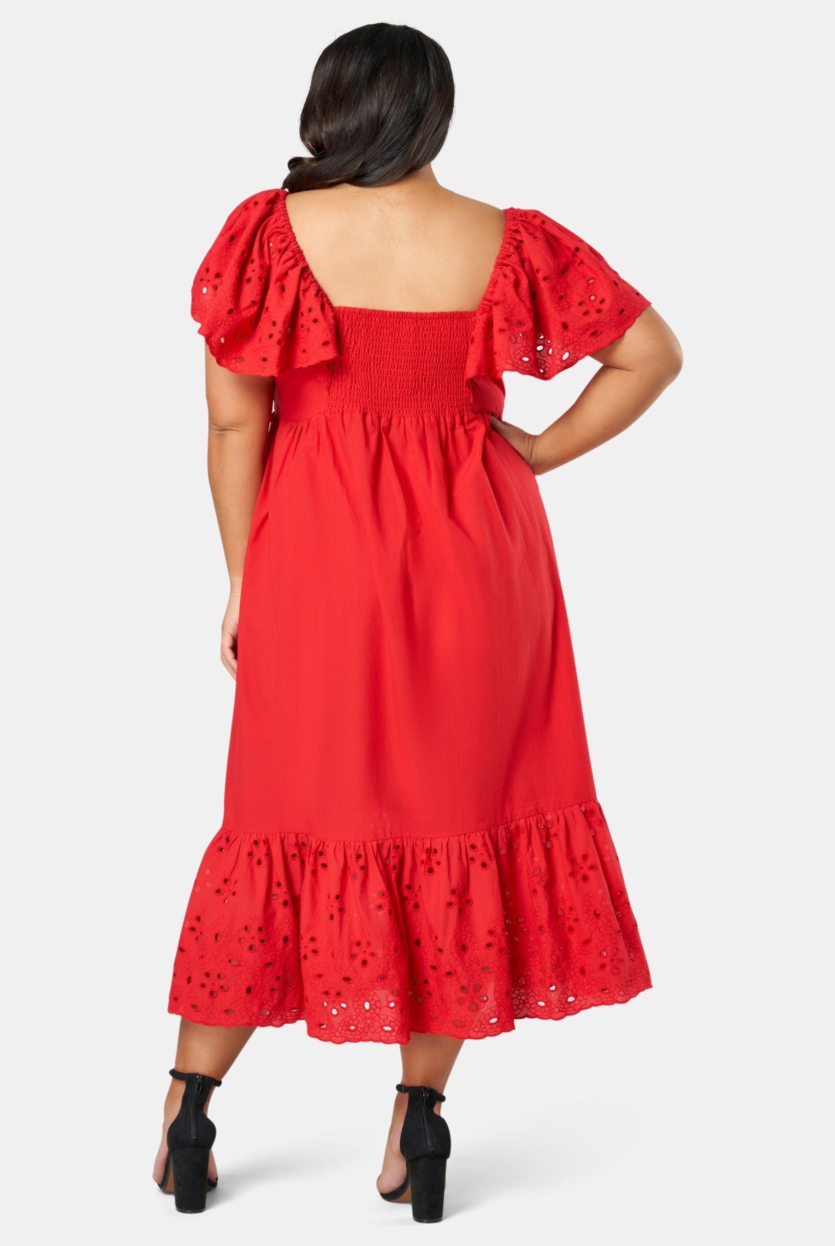 Model wearing red dress from back