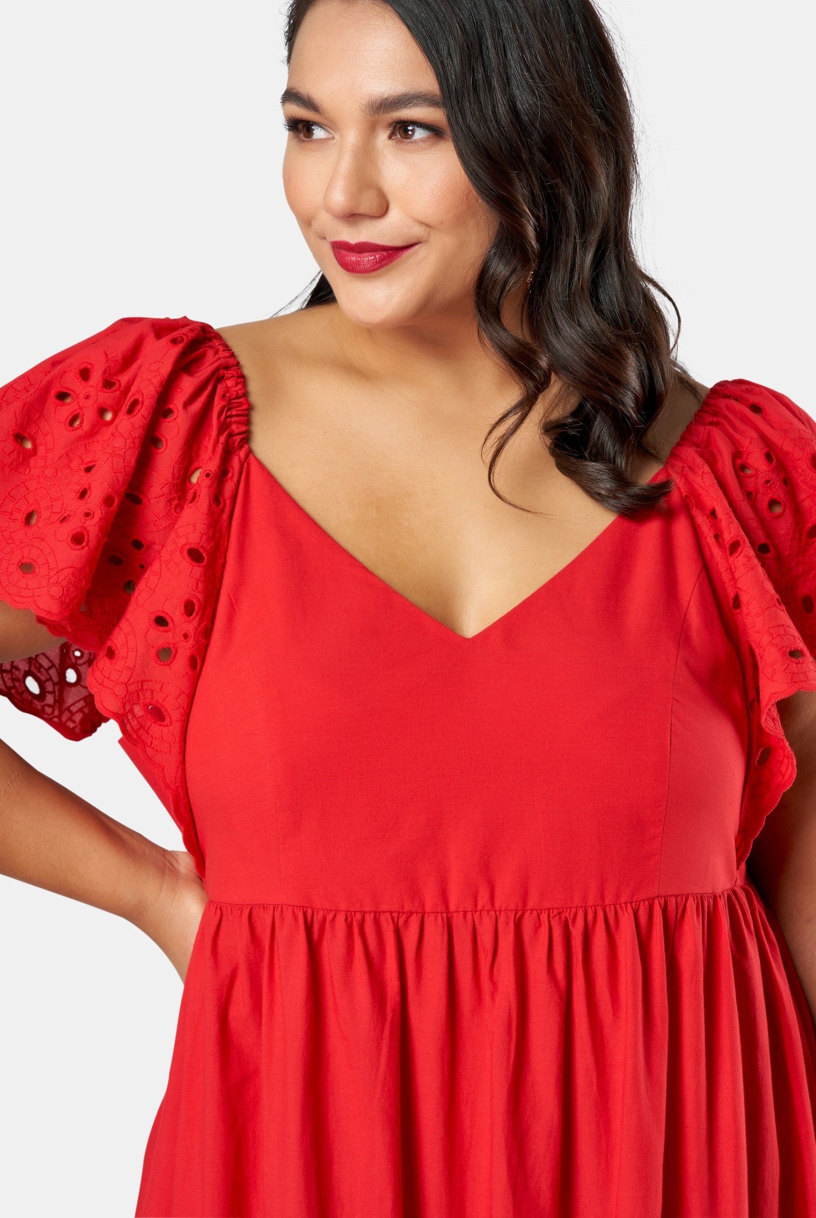 Model wearing red dress up close