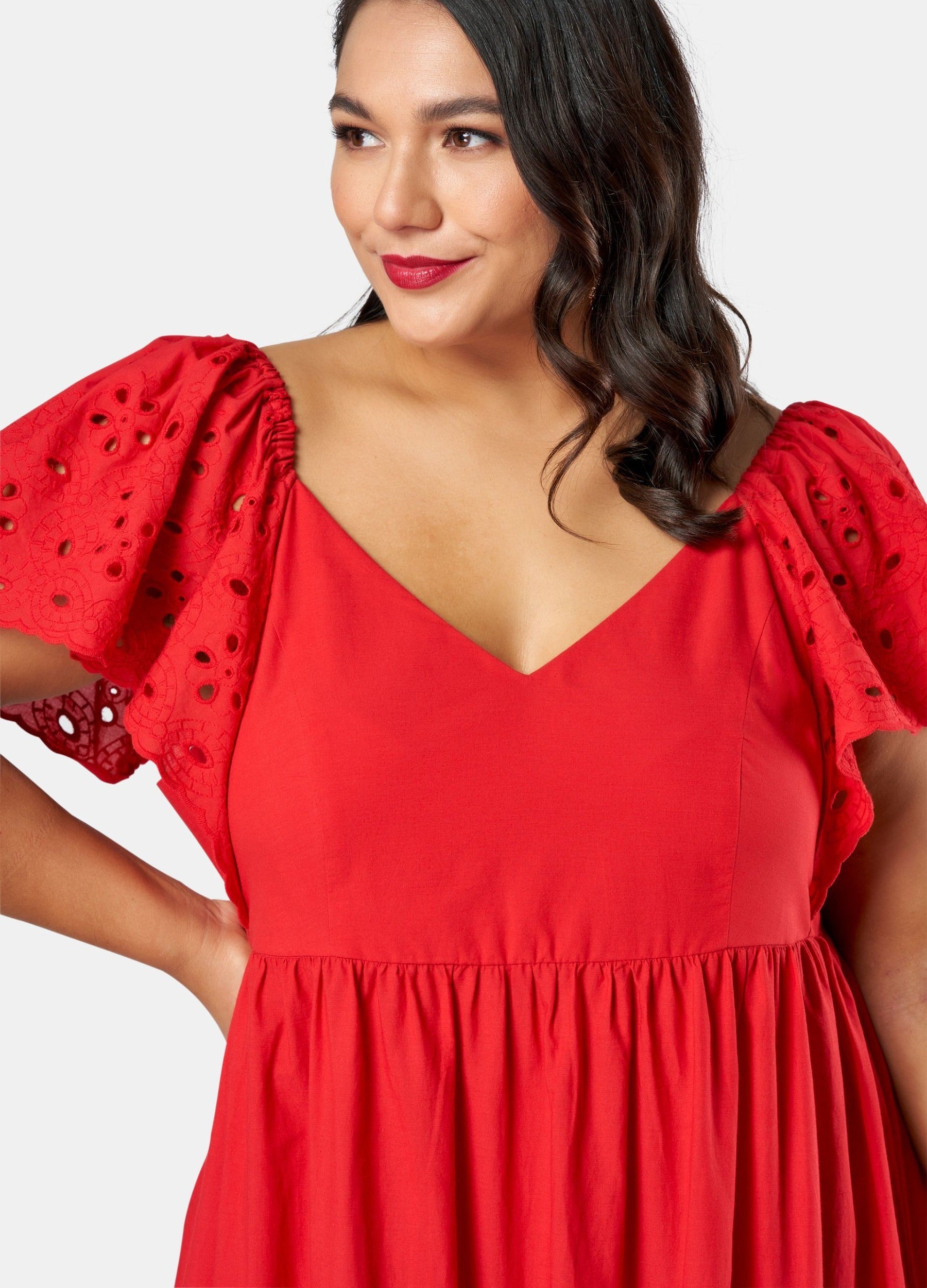 Model wearing red dress up close