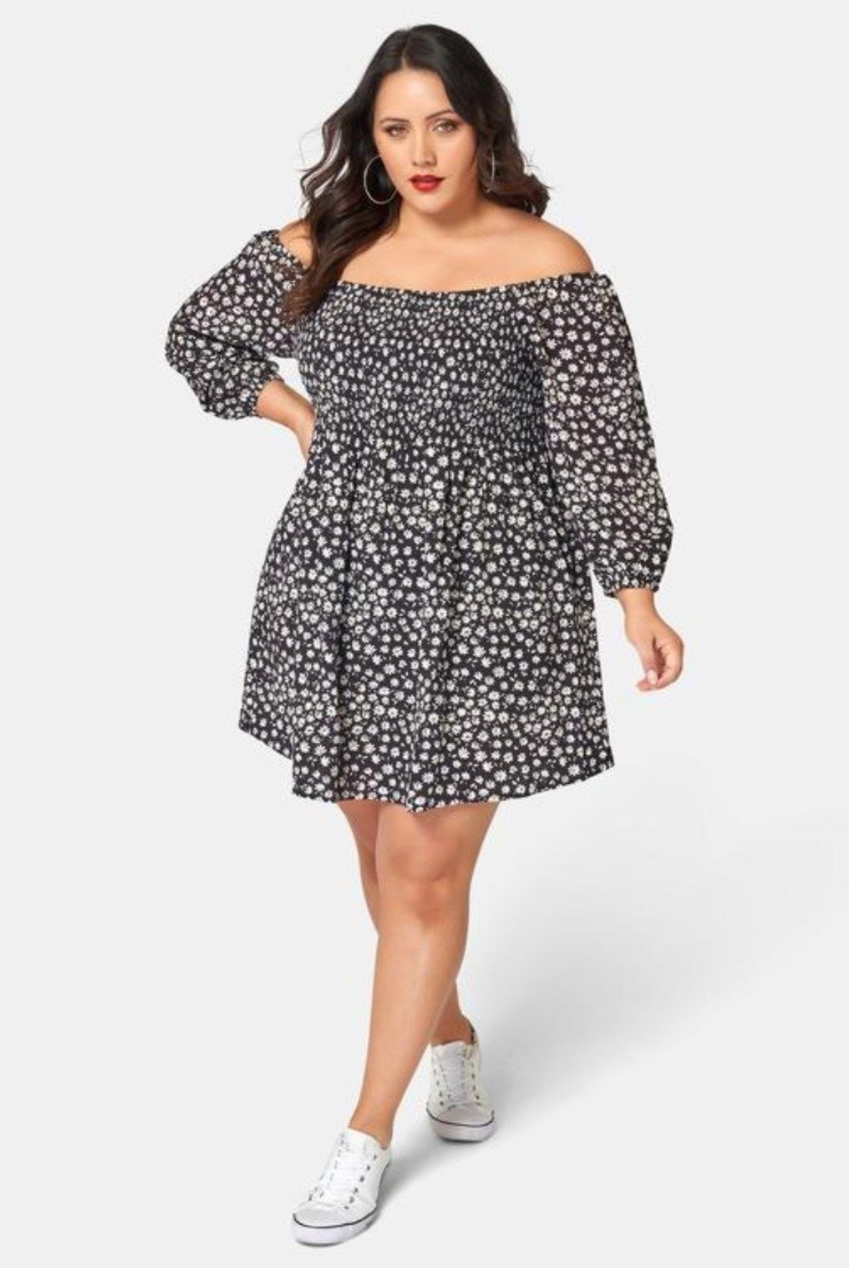 Curvy Woman wearing off shoulder floral print dress with 3/4 sleeve