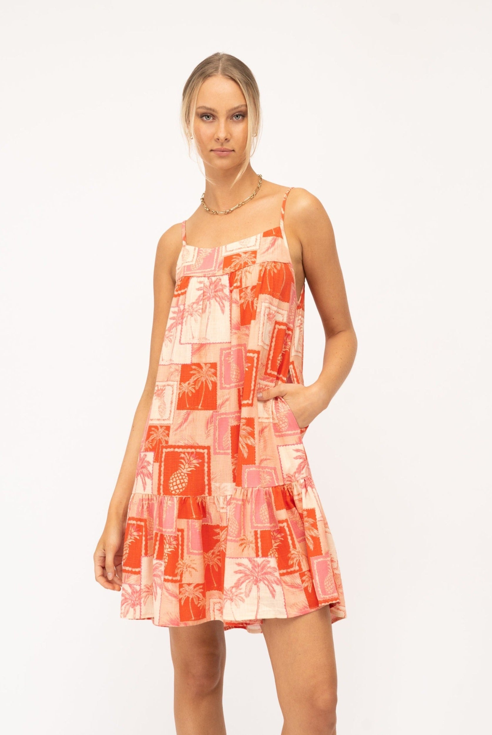 Blonde model wearing the Pina Mini Dress