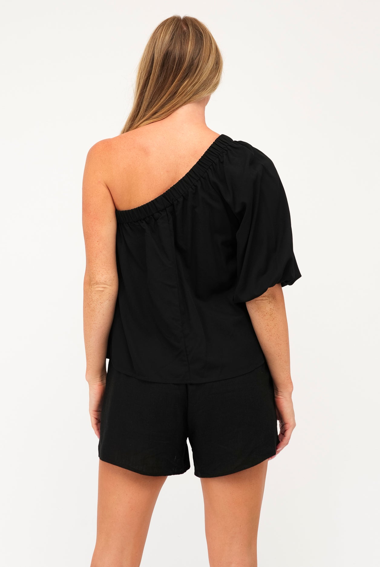 Black cotton one shoulder top with elastic cuff and shoulder detai