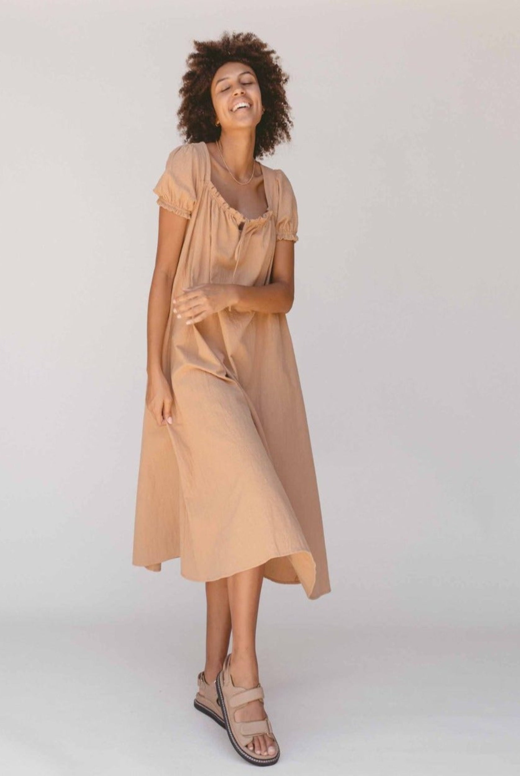 Model wearing the sawyer midi dress from the lullaby club