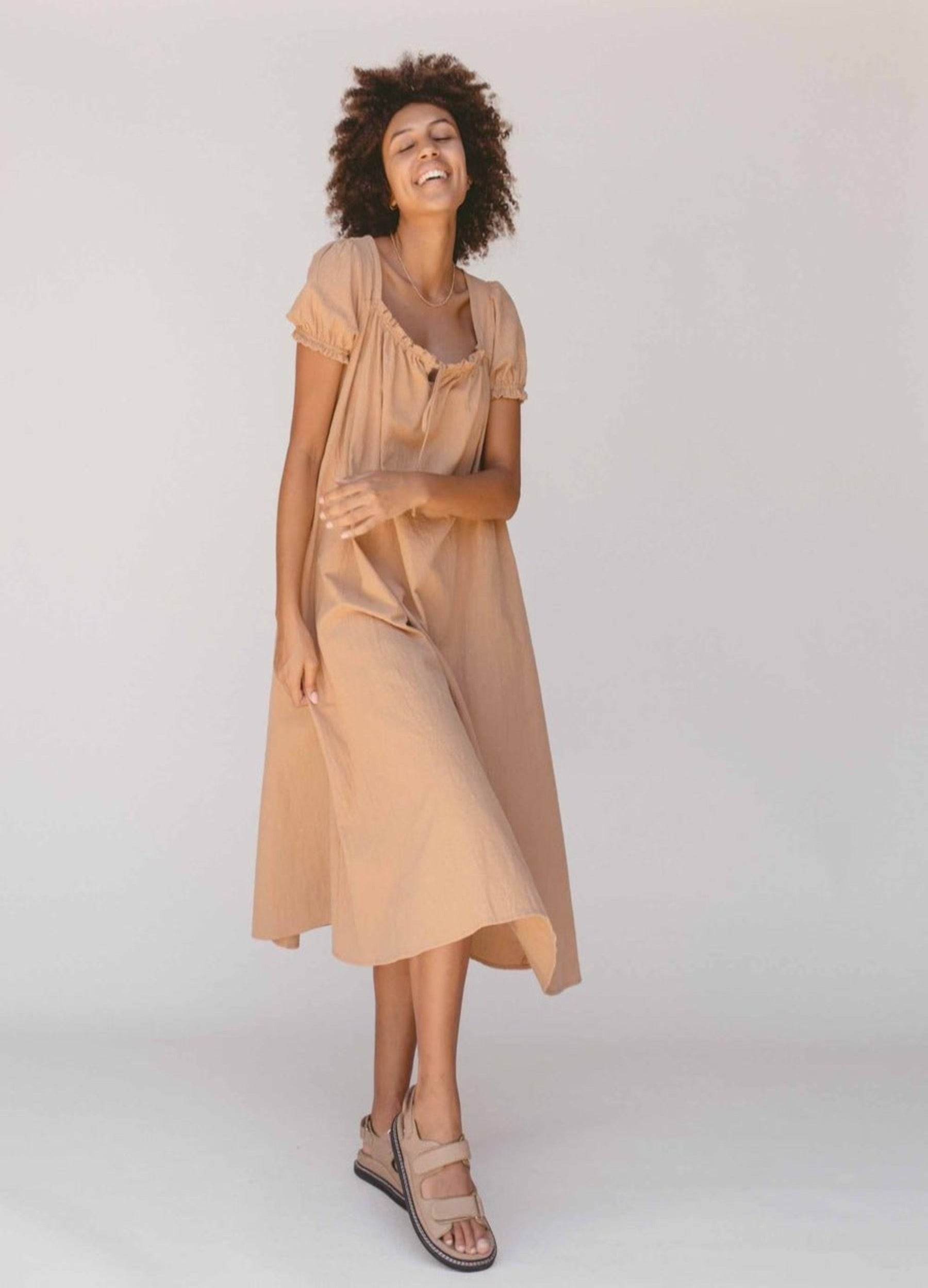 Model wearing the sawyer midi dress from the lullaby club