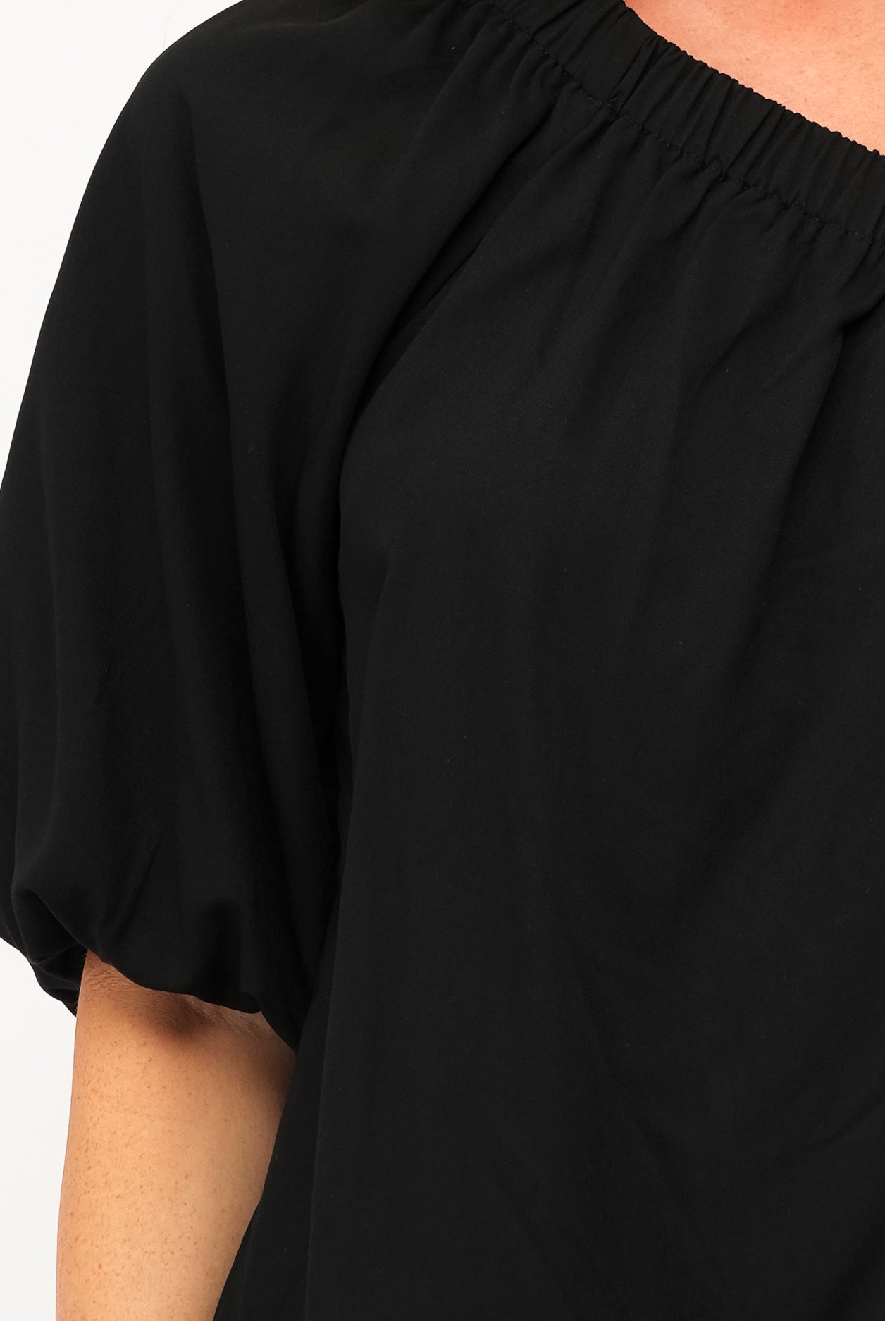Black cotton one shoulder top with elastic cuff and shoulder detai