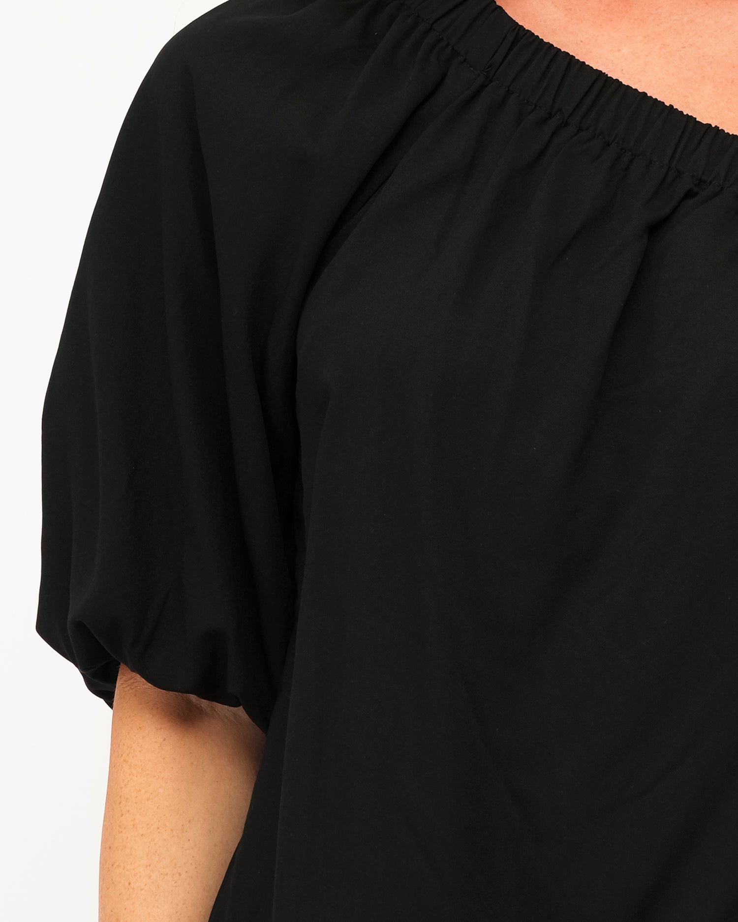 Black cotton one shoulder top with elastic cuff and shoulder detai