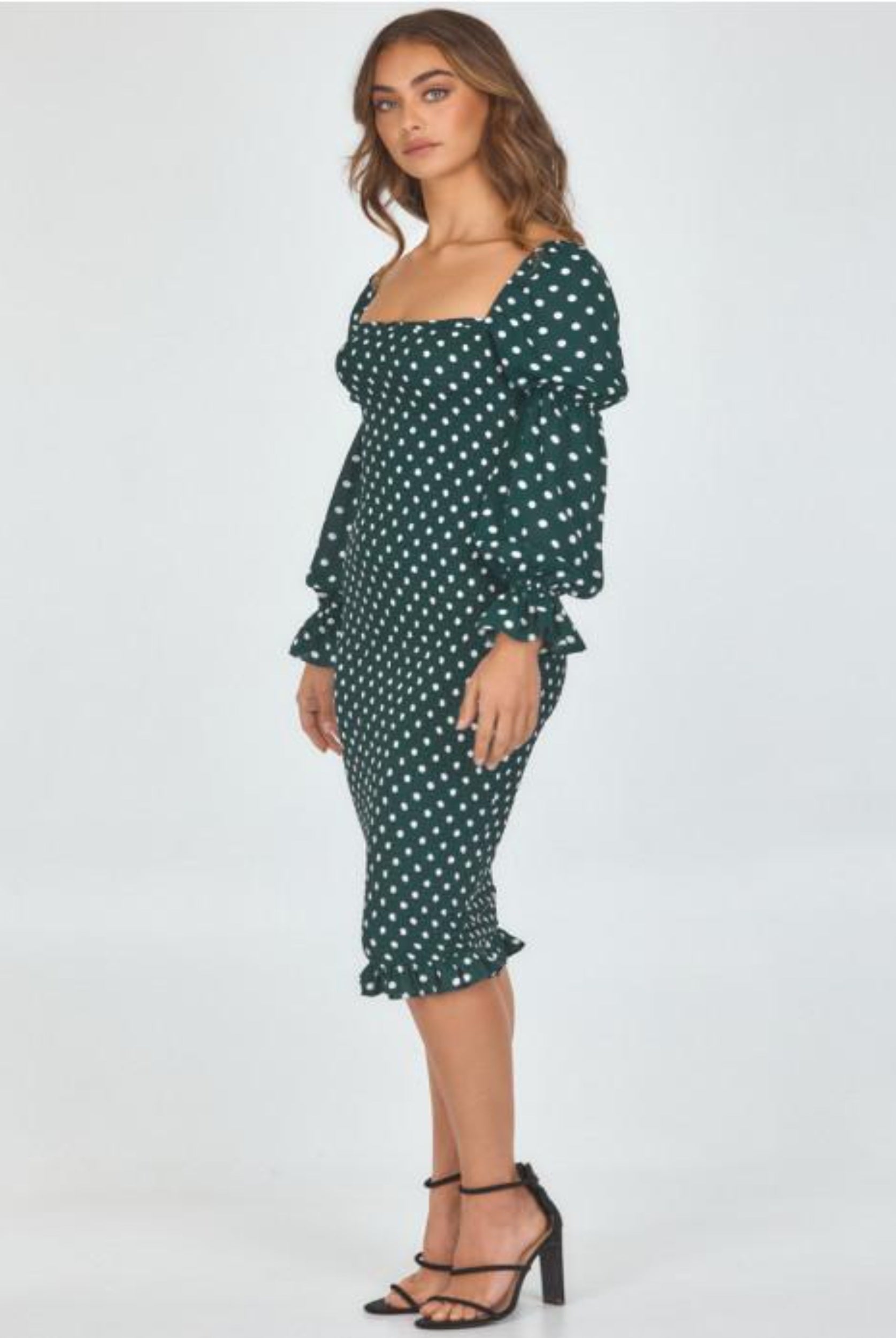 Model wearing dot print dress