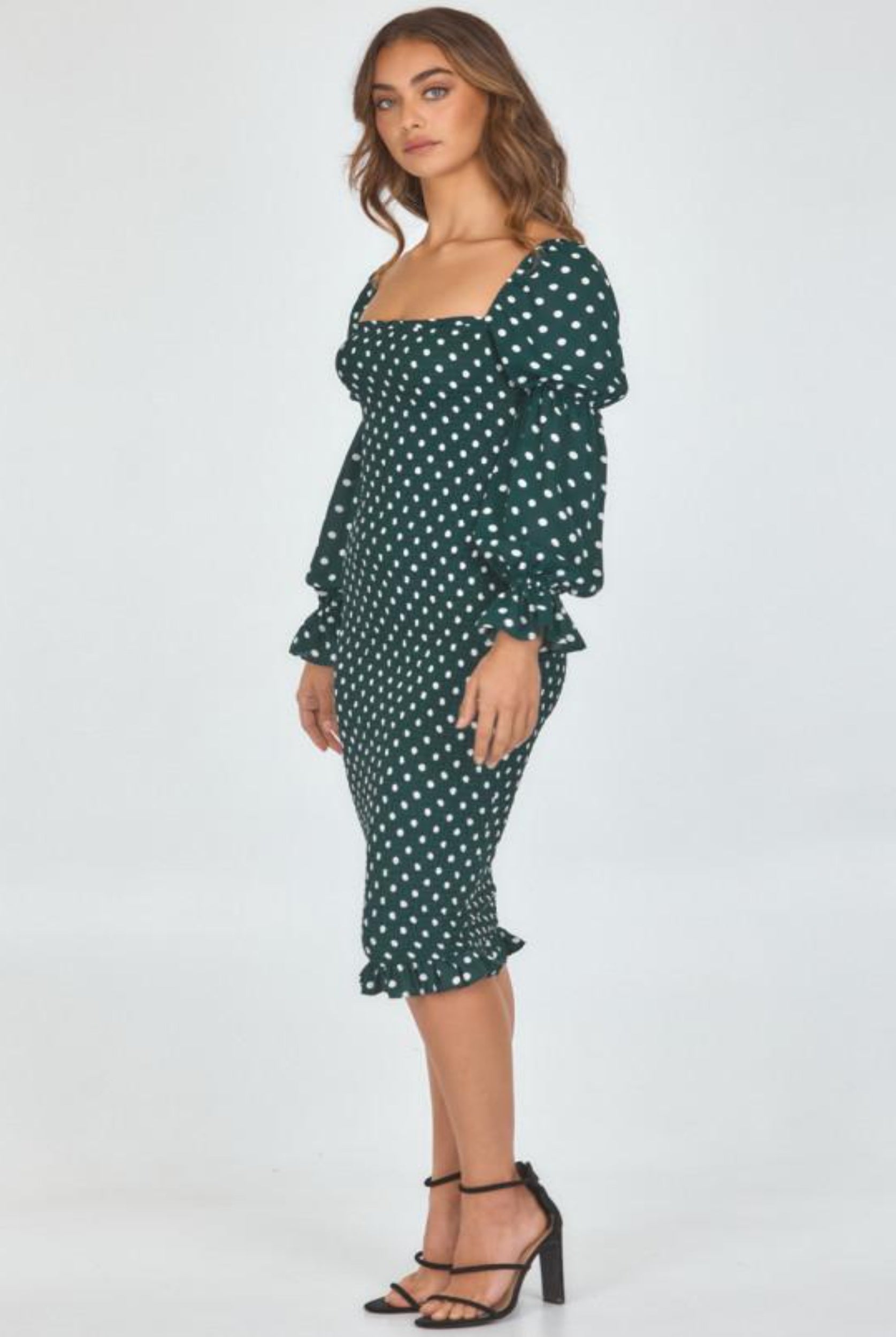 Model wearing dot print dress