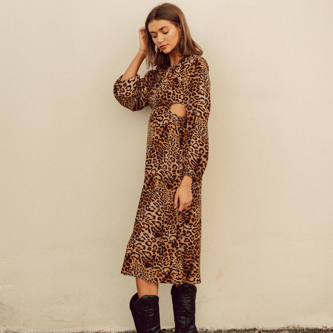 Brunette wearing animal print midi dress