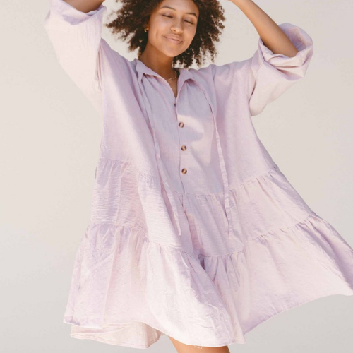 Woman wearing pastel lilac avalon smock dress from The Lullaby Club