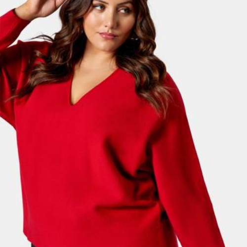 Model wearing a red knit
