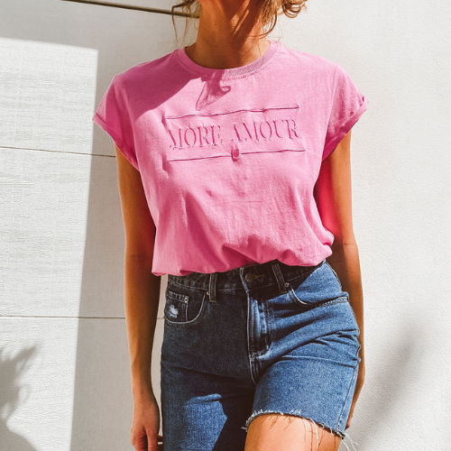 Model wearing pink more amour tee