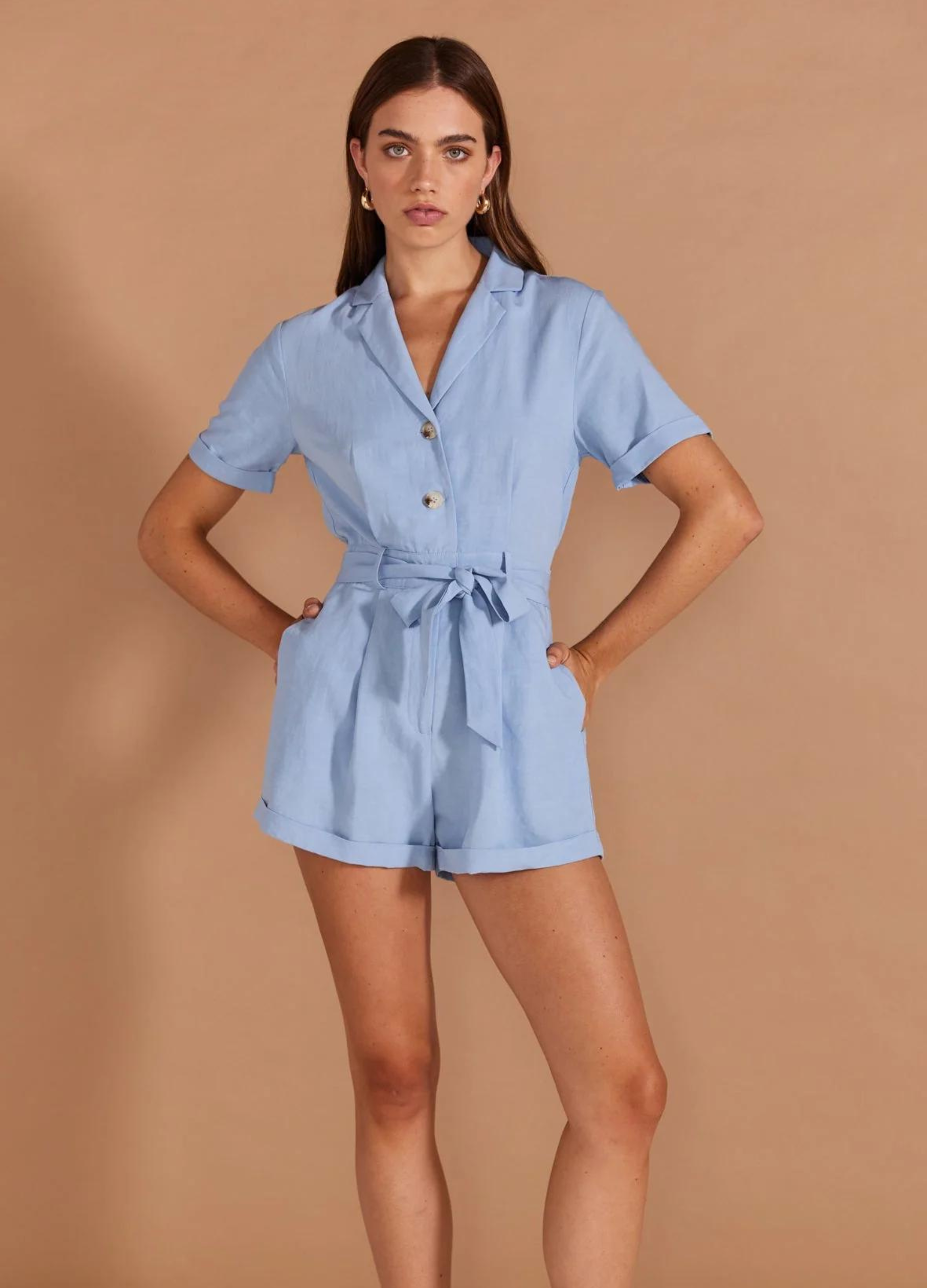 Model wearing pale blue playsuit from Staple the Label