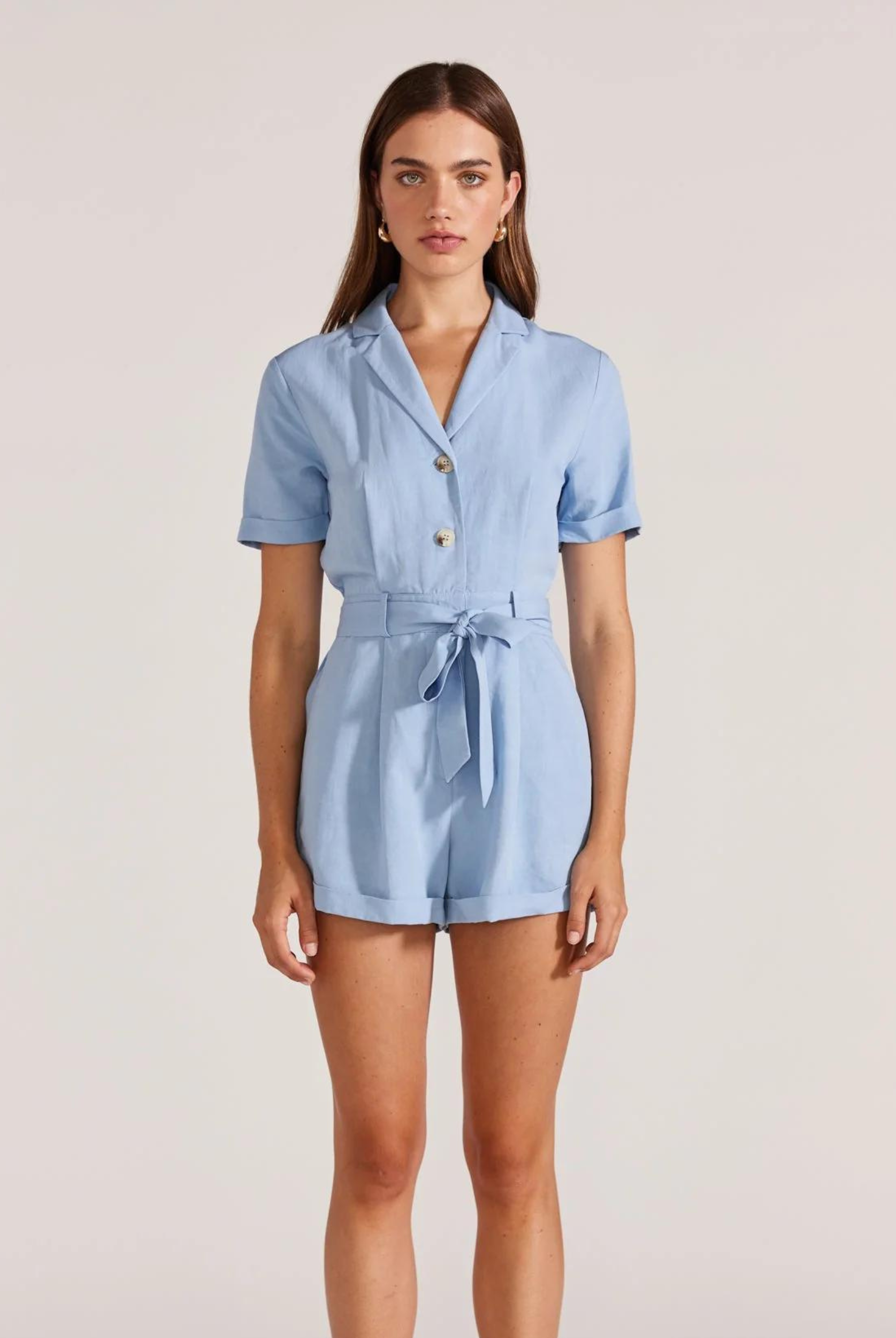 Model wearing pale blue playsuit from Staple the Label