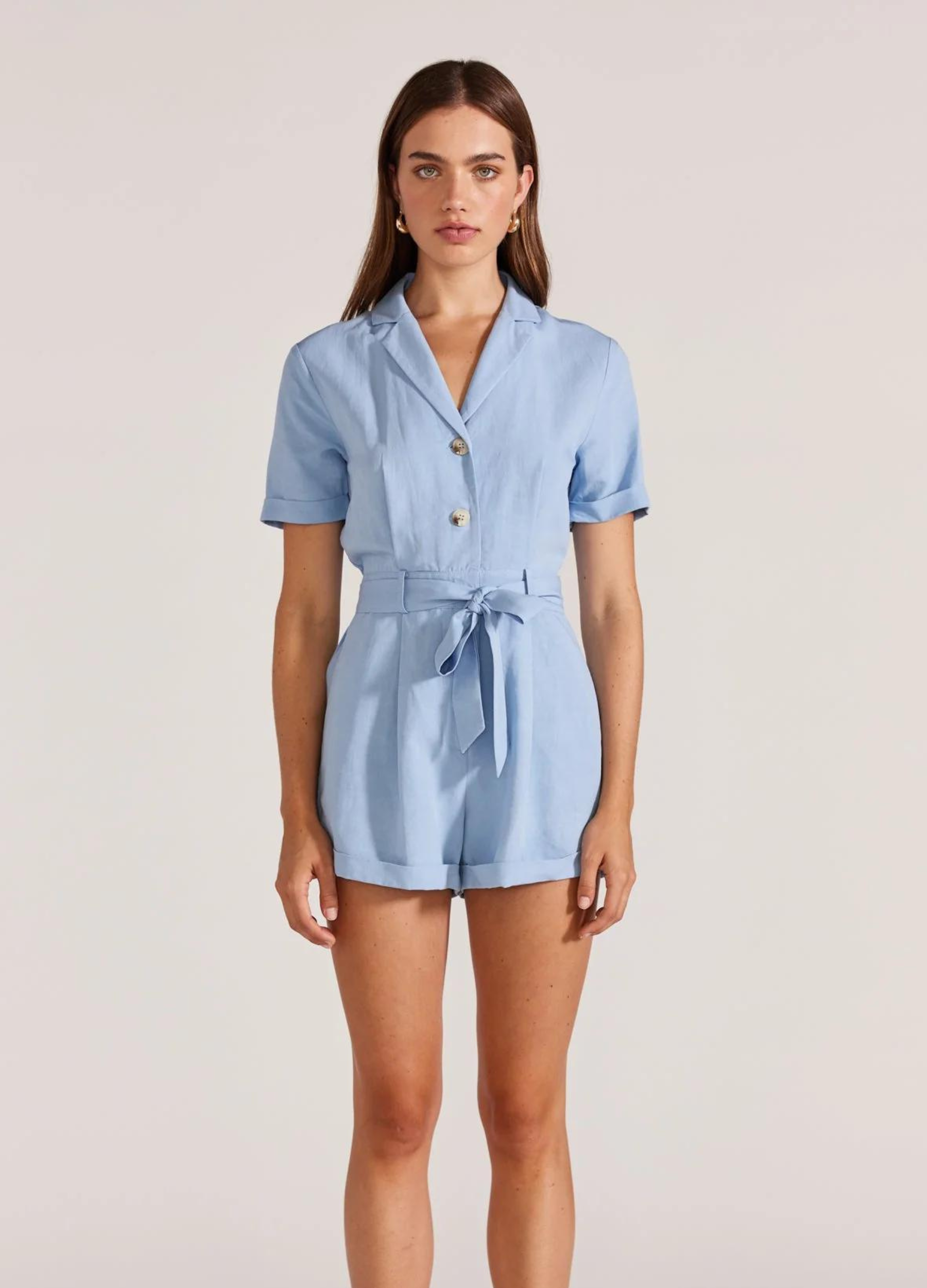 Model wearing pale blue playsuit from Staple the Label